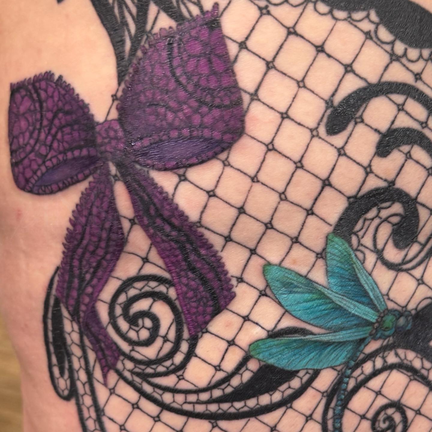 Lace butterfly dragonfly blackwork tattoo on the upper arm by PxINK, Crystal, Minnesota