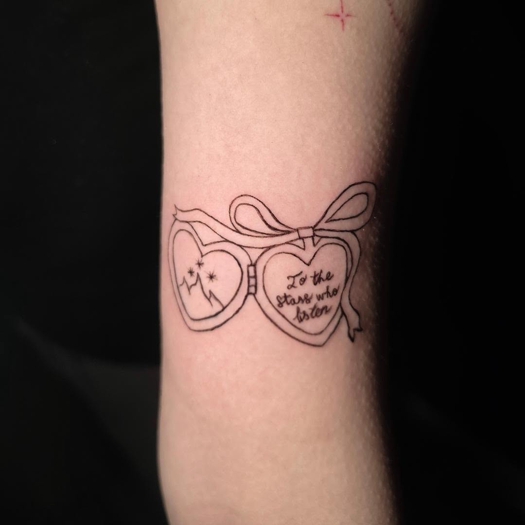 Heart-shaped glasses fine line tattoo on the forearm by Scar