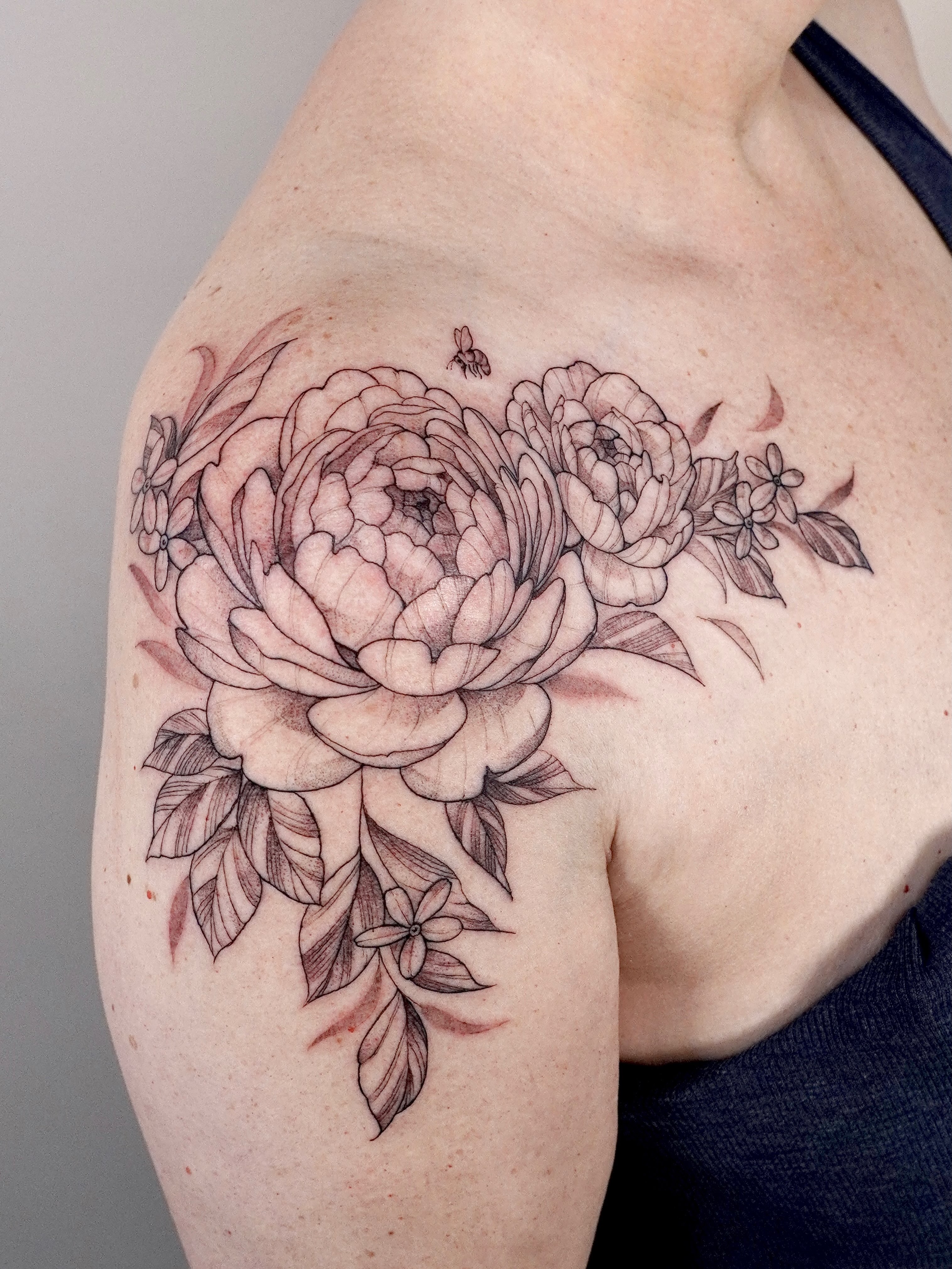 Peony bouquet realism tattoo on the shoulder by Marianna D D King