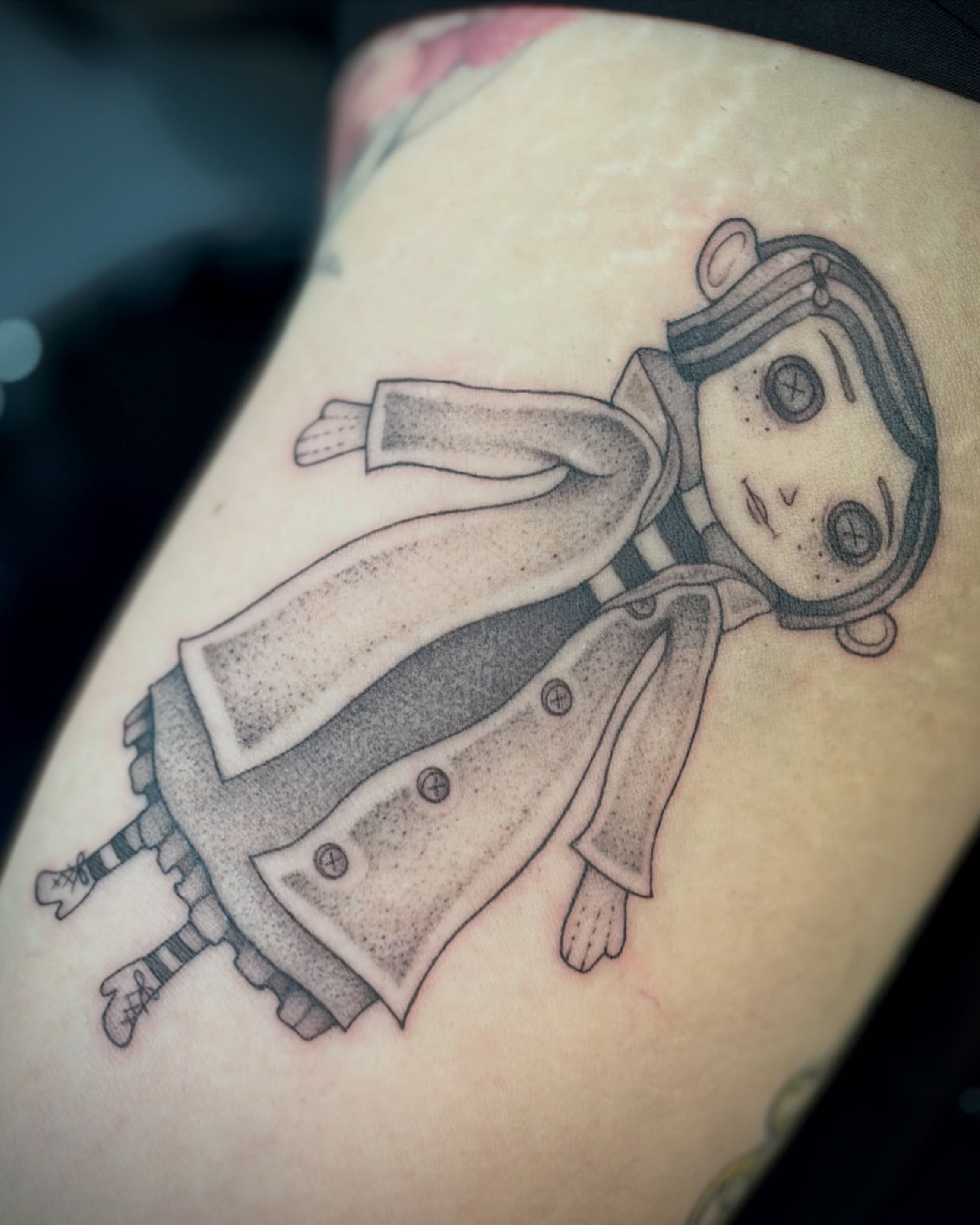 Robotic figure dotwork tattoo on the thigh by Victoria Lamorte