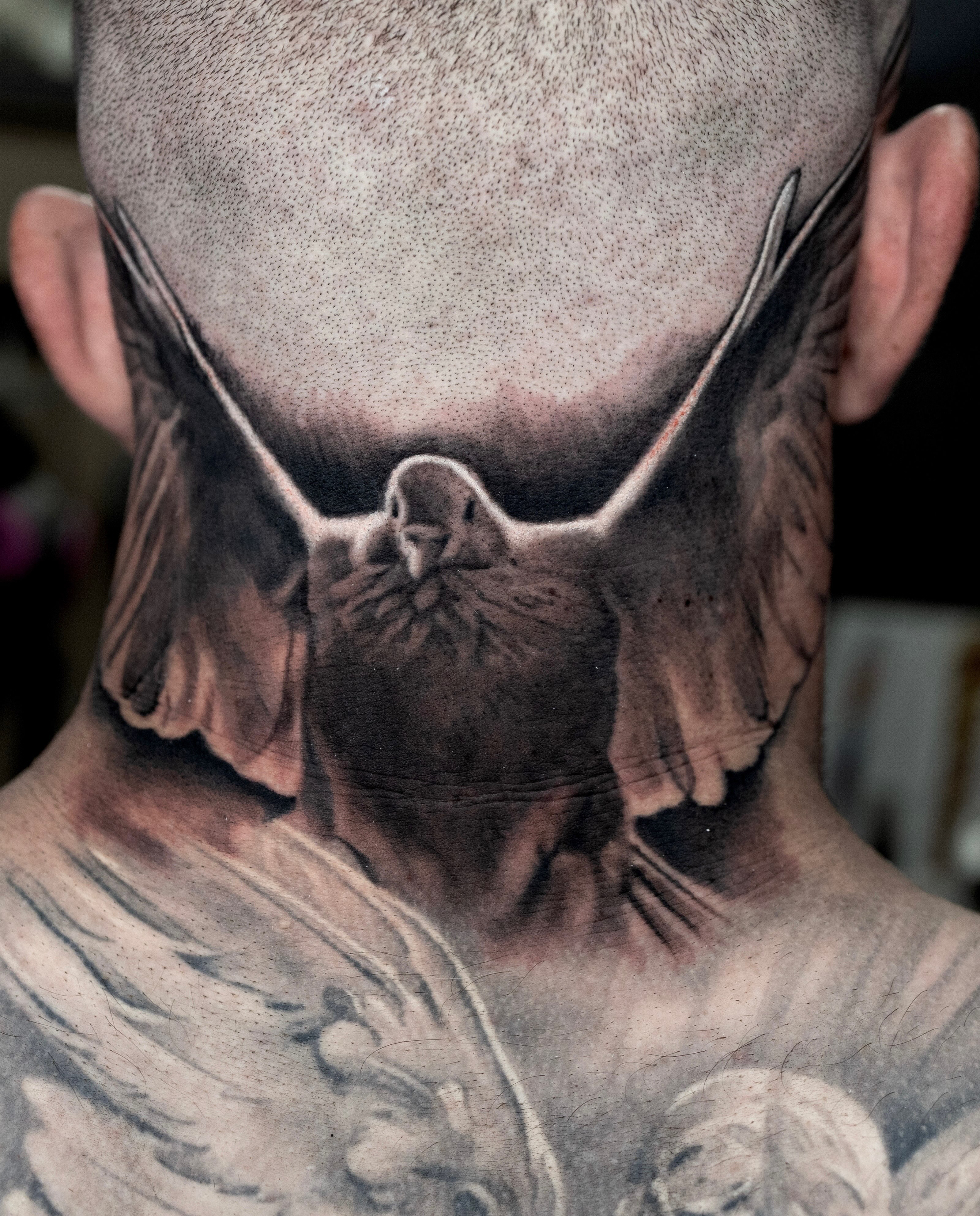 Bird dotwork tattoo on the neck by Realistic tattoos in Minneapolis, MN, Minneapolis, Minnesota