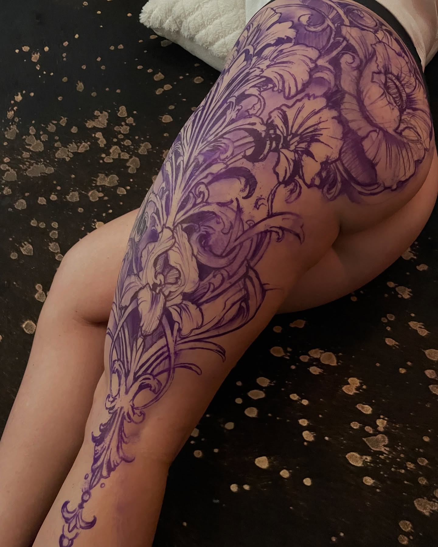 Floral design ornamental tattoo on the thigh by David Garner, Los Angeles, California