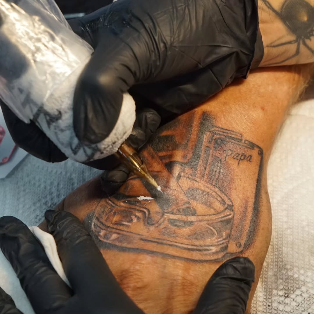 Washing machine black and grey tattoo on the forearm by Tattoo Seez, Wichita, Kansas