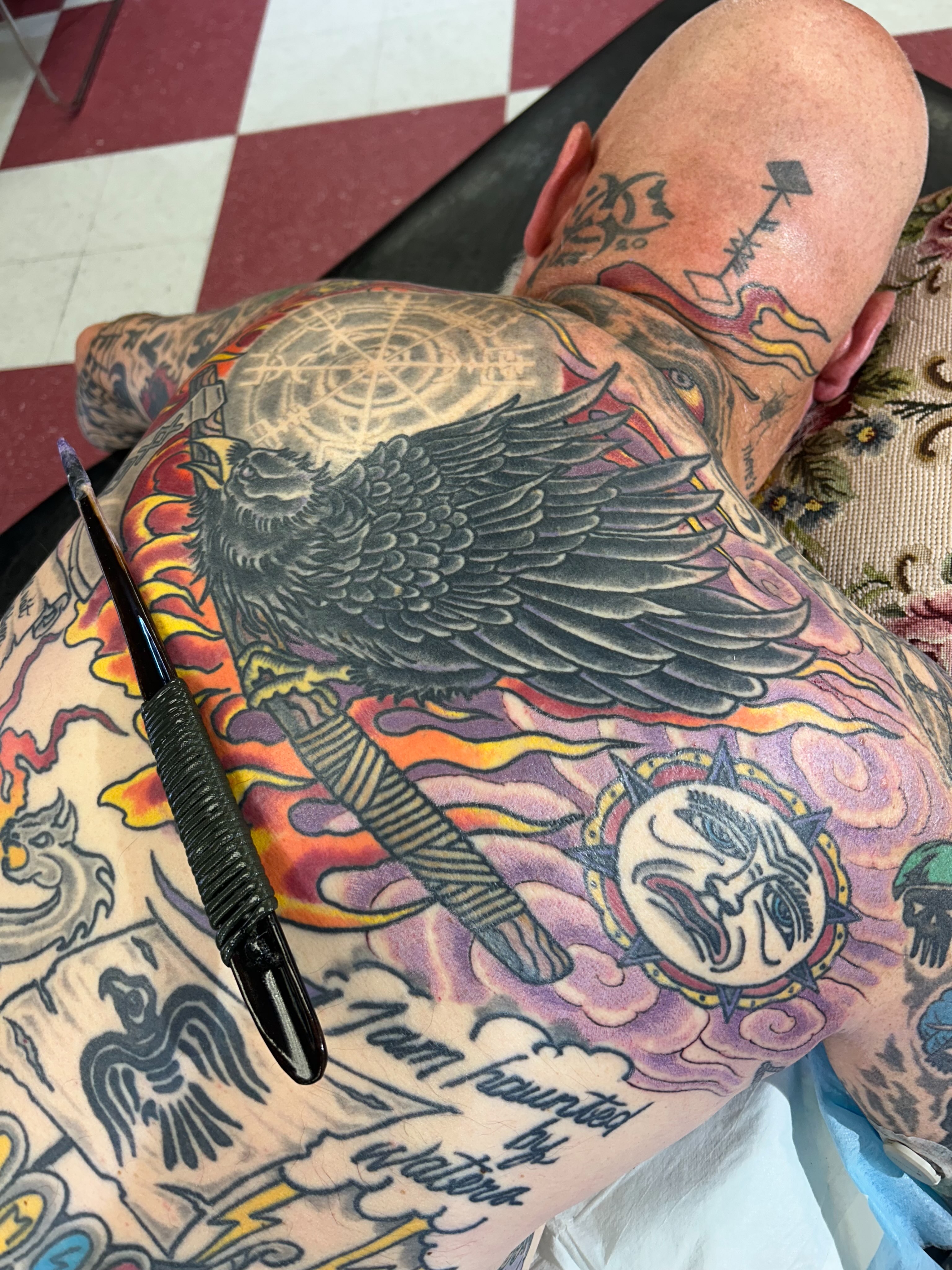 Crow and sun American traditional tattoo on the back by Jim Rosal
