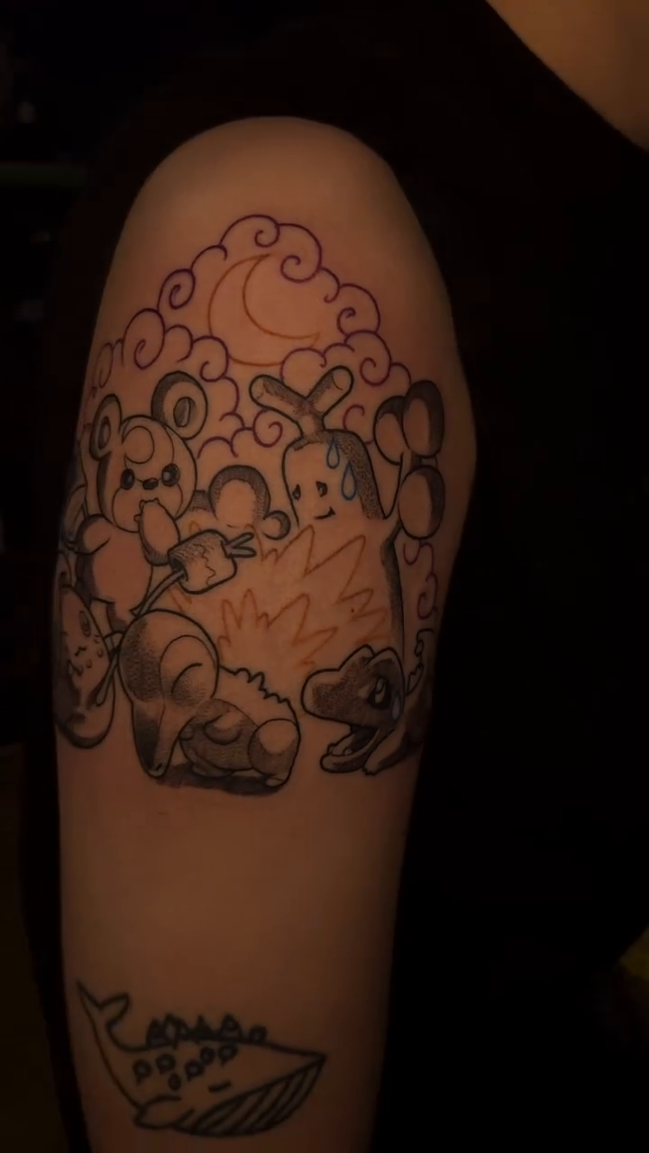 Cartoonish animal with clouds and moon new school tattoo on the upper arm by Lillian Honeybadger