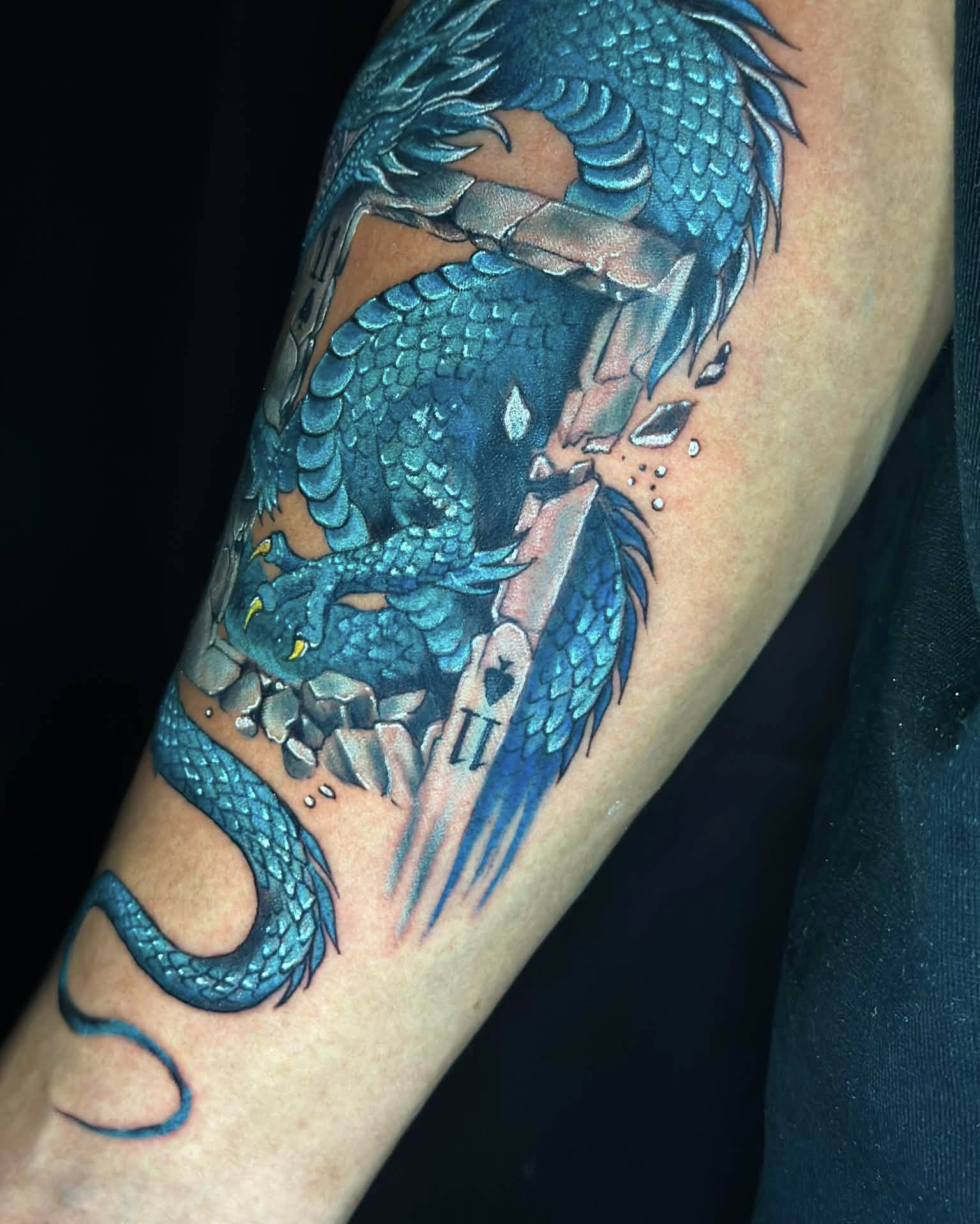 Dragon realism tattoo on the forearm by Stephen Degracia