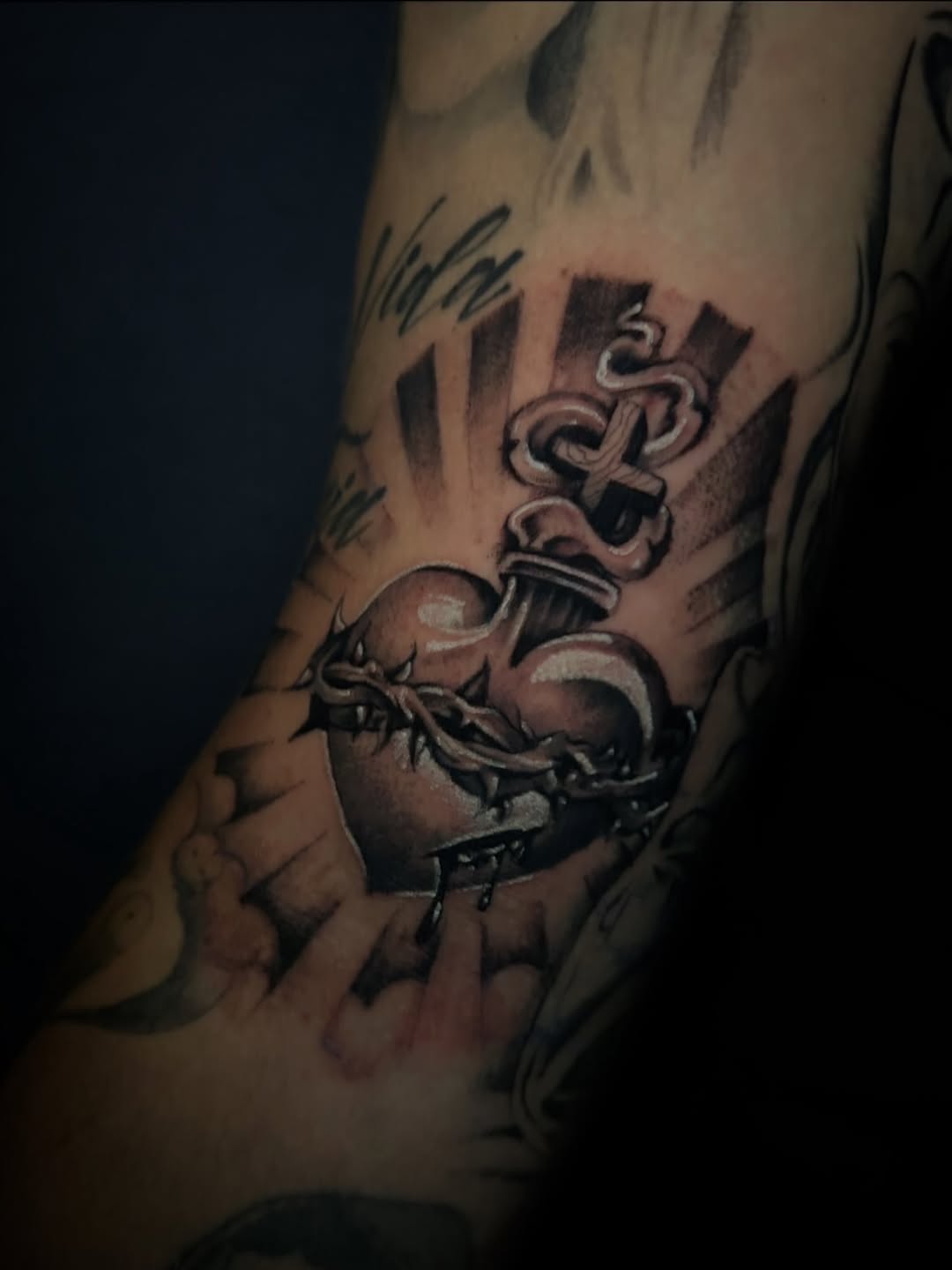 Sacred heart with crown of thorns Chicano tattoo on the forearm by Marky