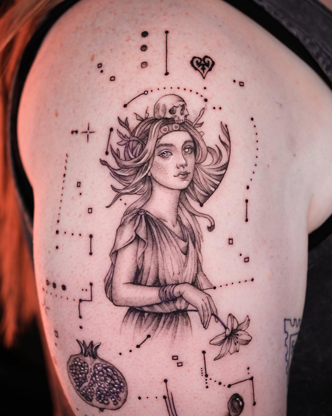Woman with skull and pomegranate realism tattoo on the shoulder by Tattoo Miami π