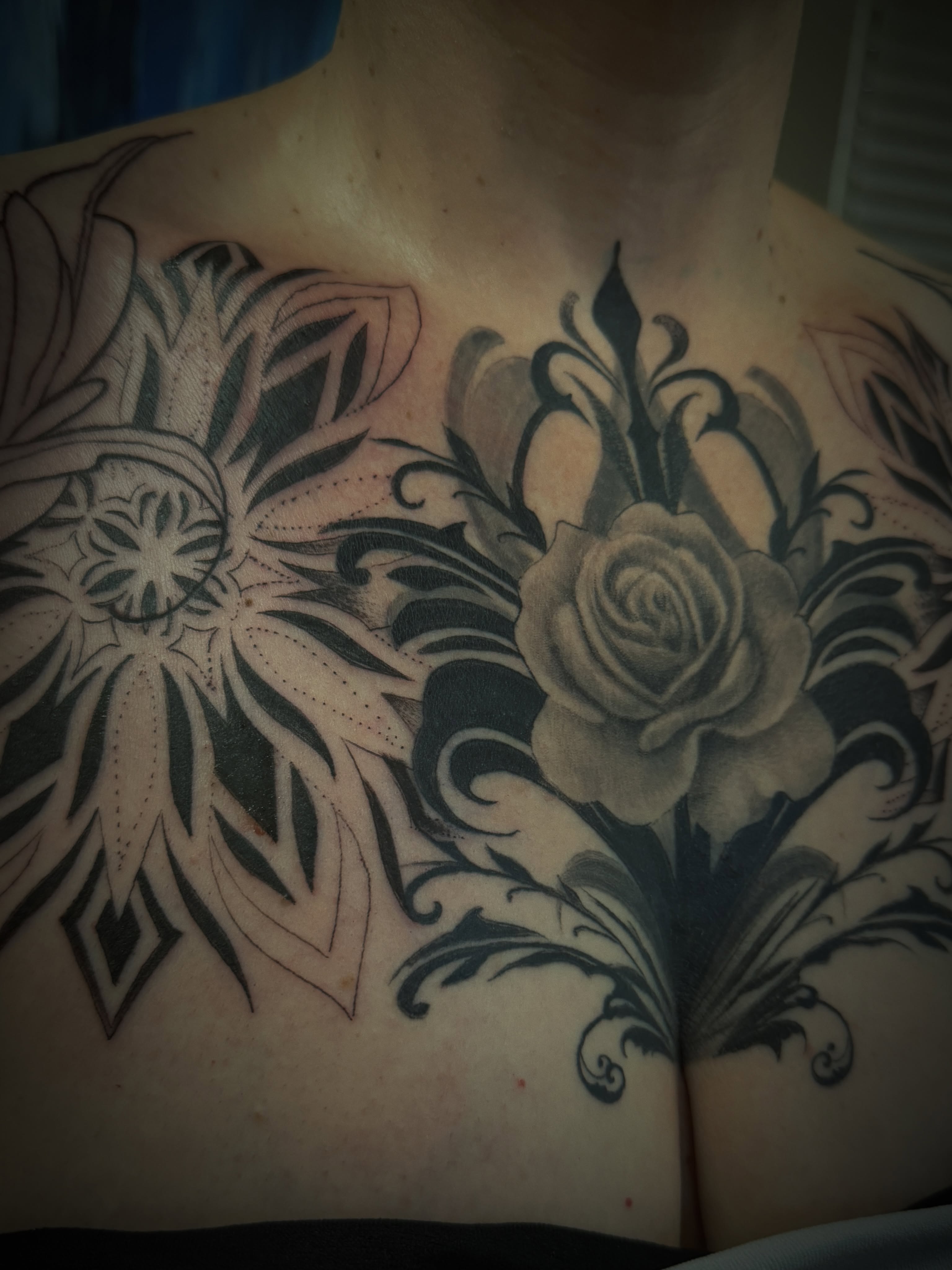 Floral design black and grey tattoo on the chest by Die Ivo, Bielefeld, Germany