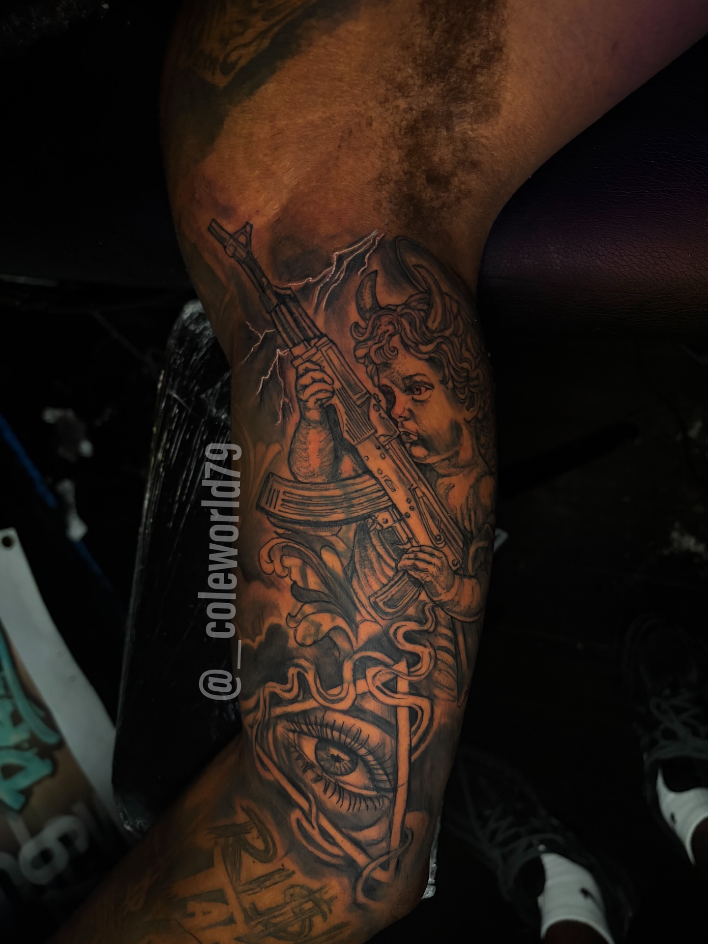 Angel with gun neo-traditional tattoo on the forearm by Chicago tattoo artist
