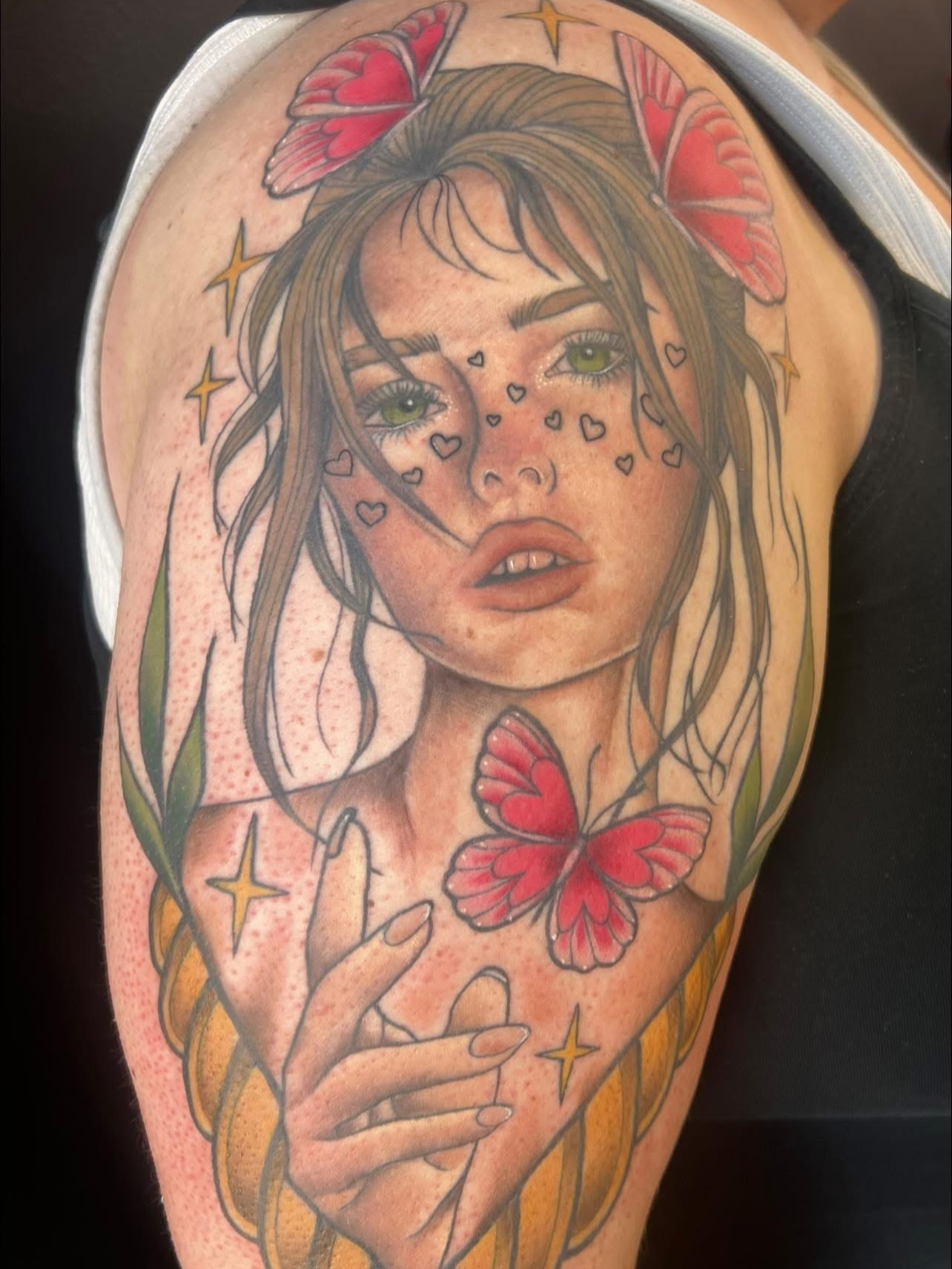 Girl with butterflies realism tattoo on the shoulder by Olivia Suzanne Fada