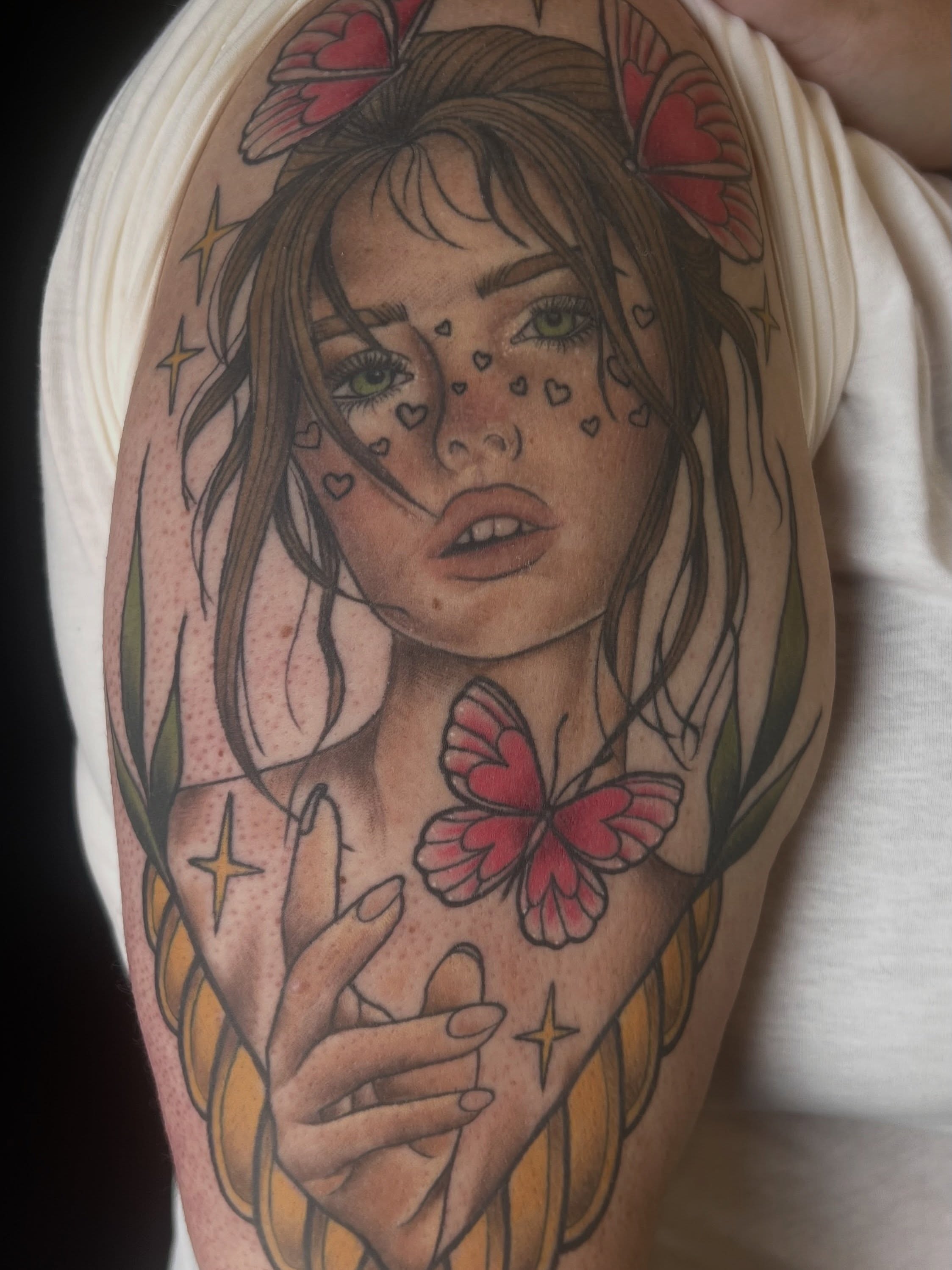 Woman with butterflies realism tattoo on the upper arm by Olivia Suzanne Fada