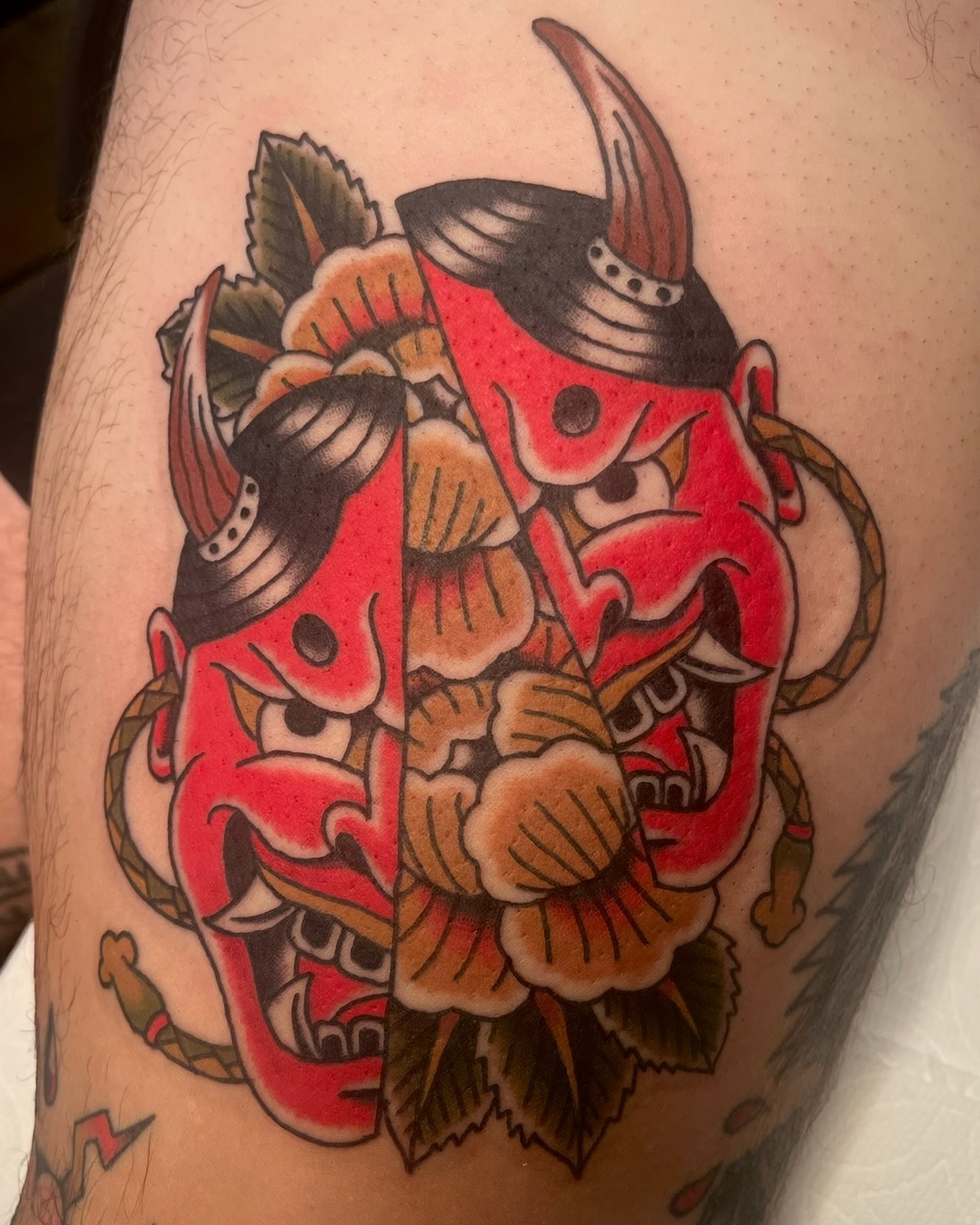 Demon mask American traditional tattoo on the forearm by Tiffani Thompson, San Diego, California