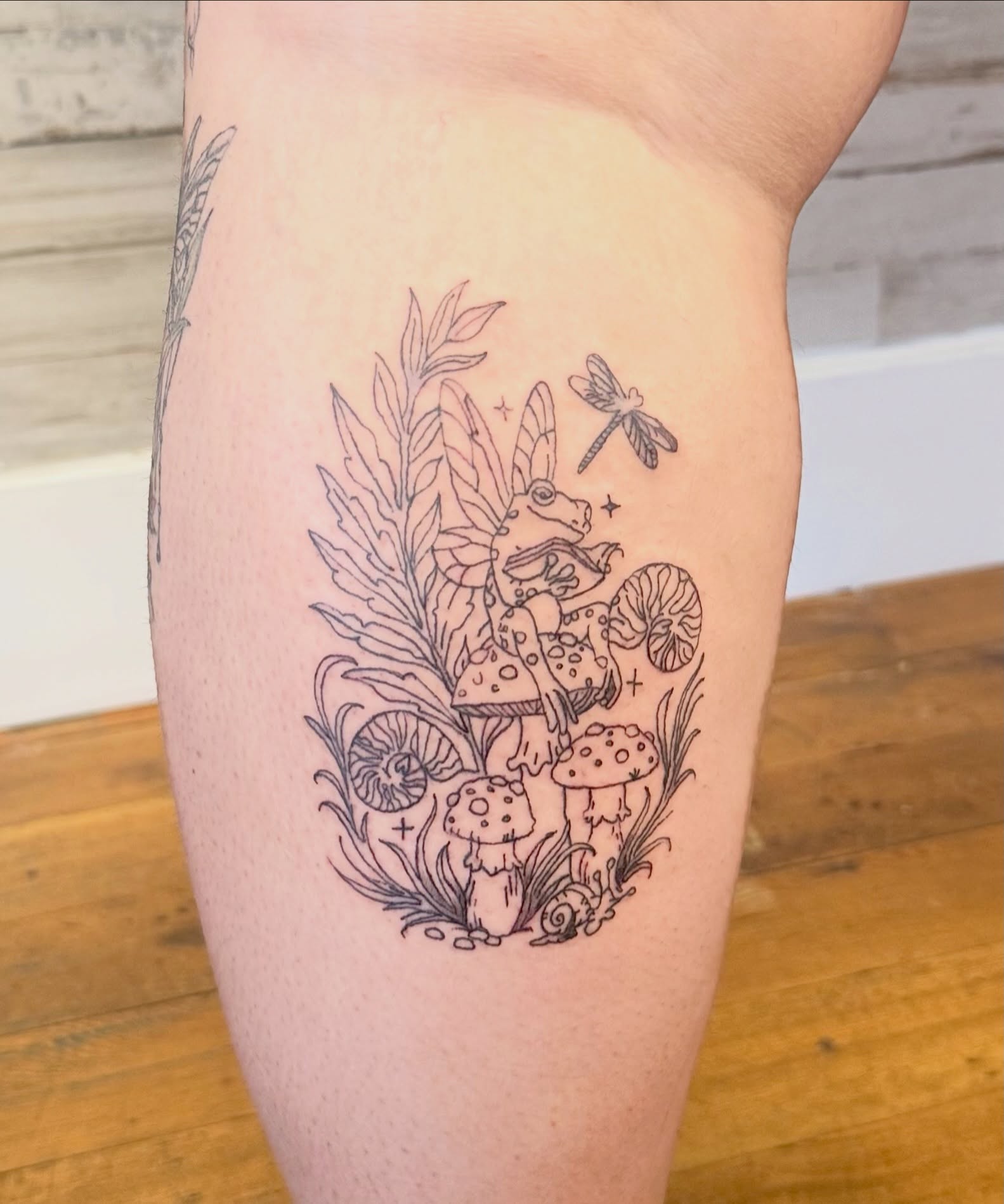 Fairy and mushrooms illustrative tattoo on the thigh by Whimsy Ink