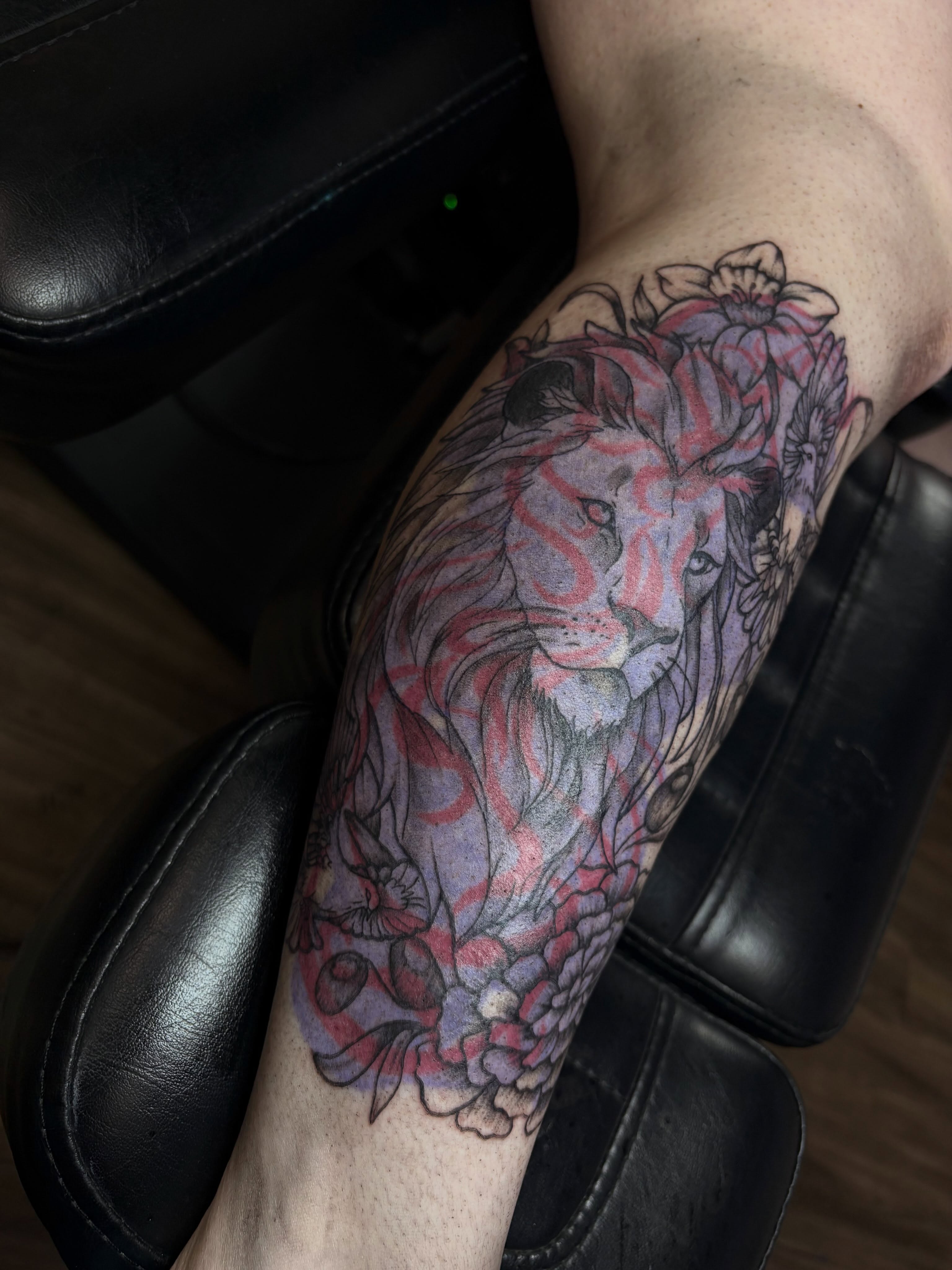 Lion watercolor tattoo on the forearm by Cincinnati Tattoo Artist
