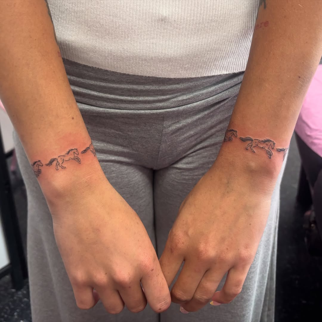 Horses black and grey tattoo on the forearm by Mickey