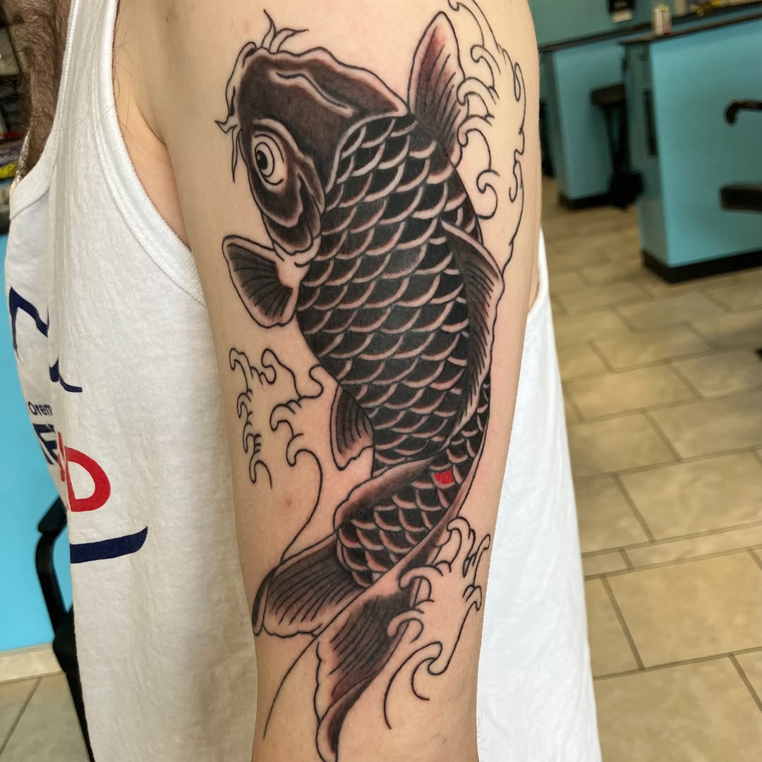 Koi fish with waves Japanese tattoo on the forearm by Bryant Johnson