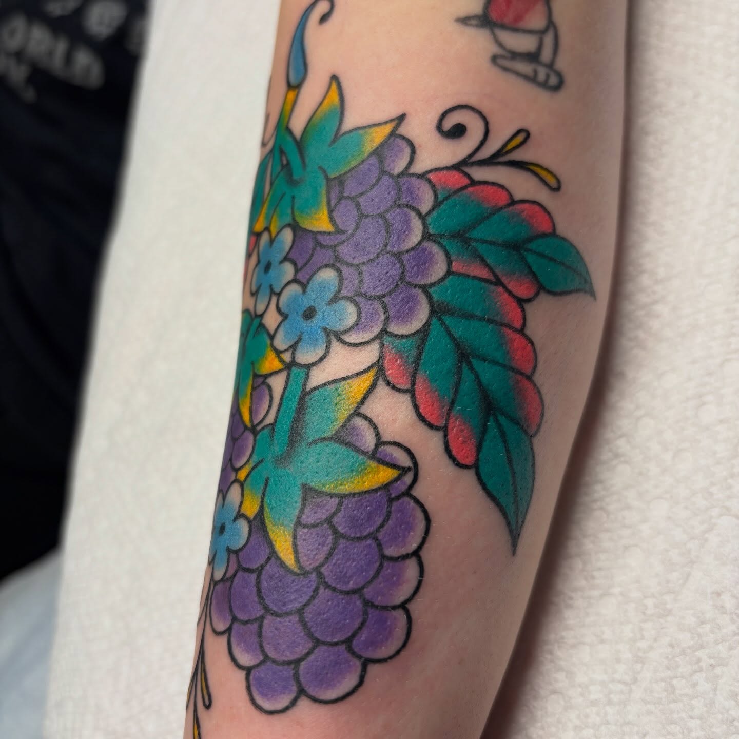 Grapes and flowers American traditional tattoo on the forearm by ❁ Tat2friend ❁