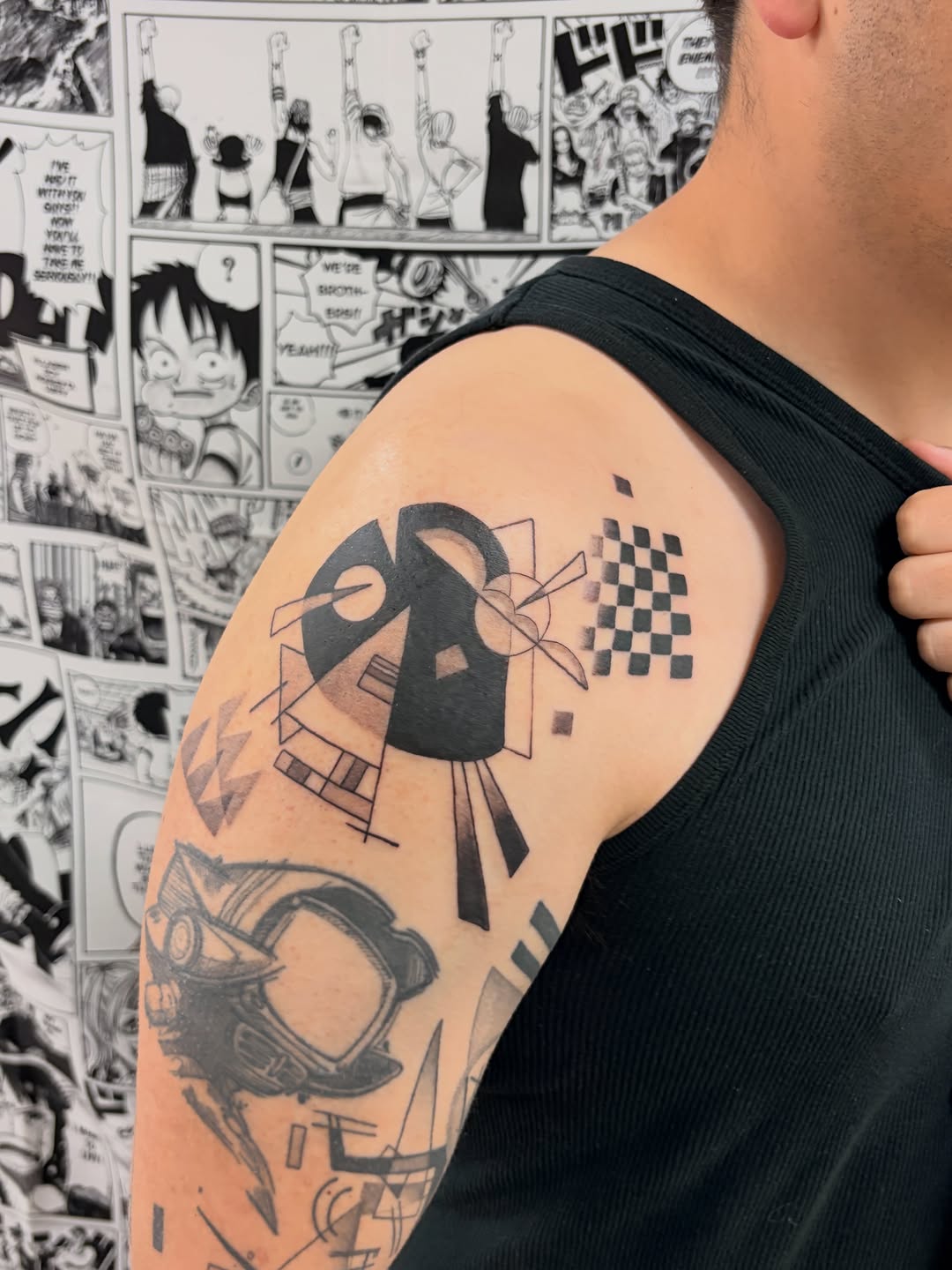 Abstract geometric shapes ignorant tattoo on the upper arm by Chris, Cleveland, Ohio