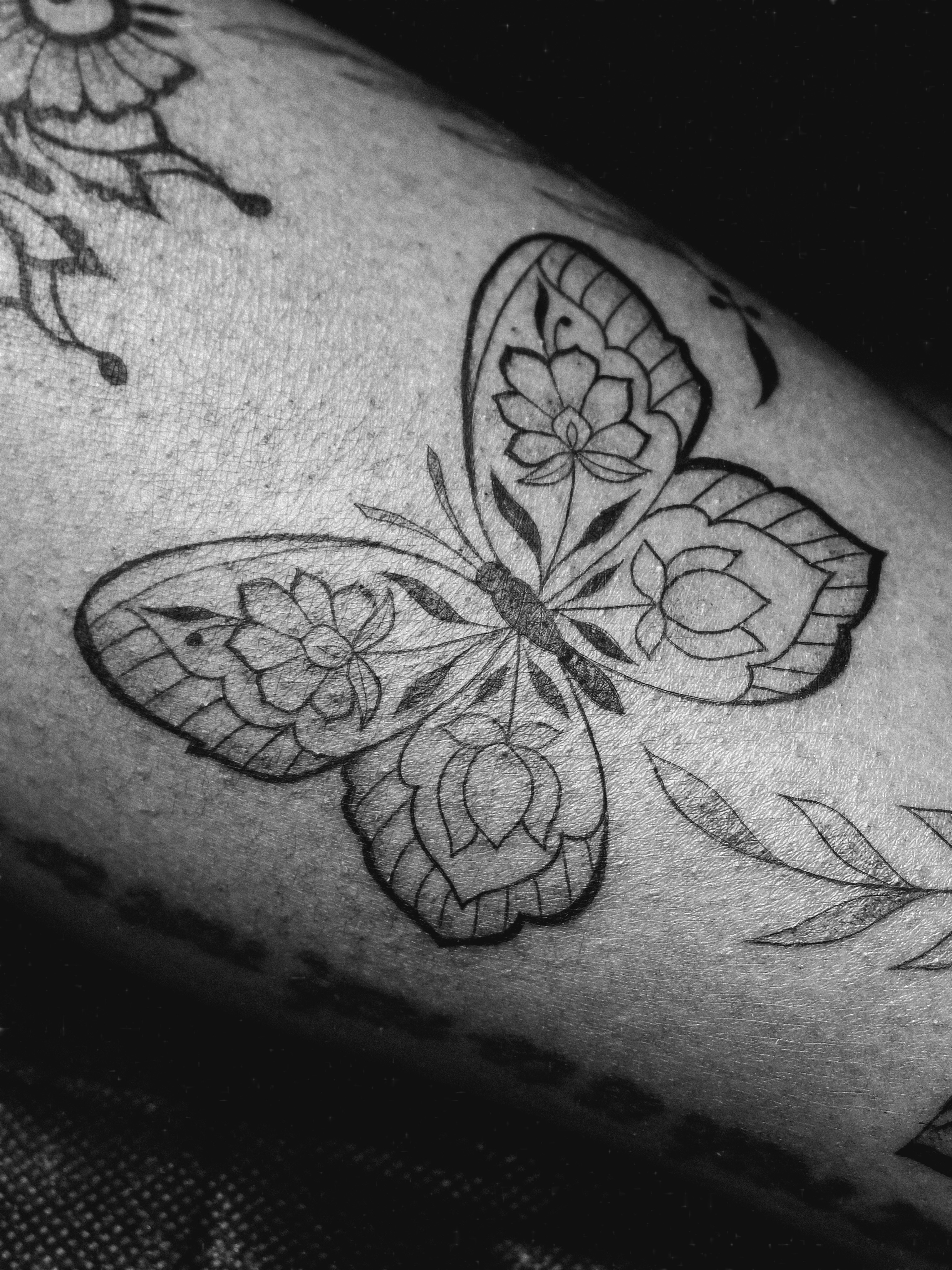 Butterfly black and grey tattoo on the forearm by Sabreena Haque