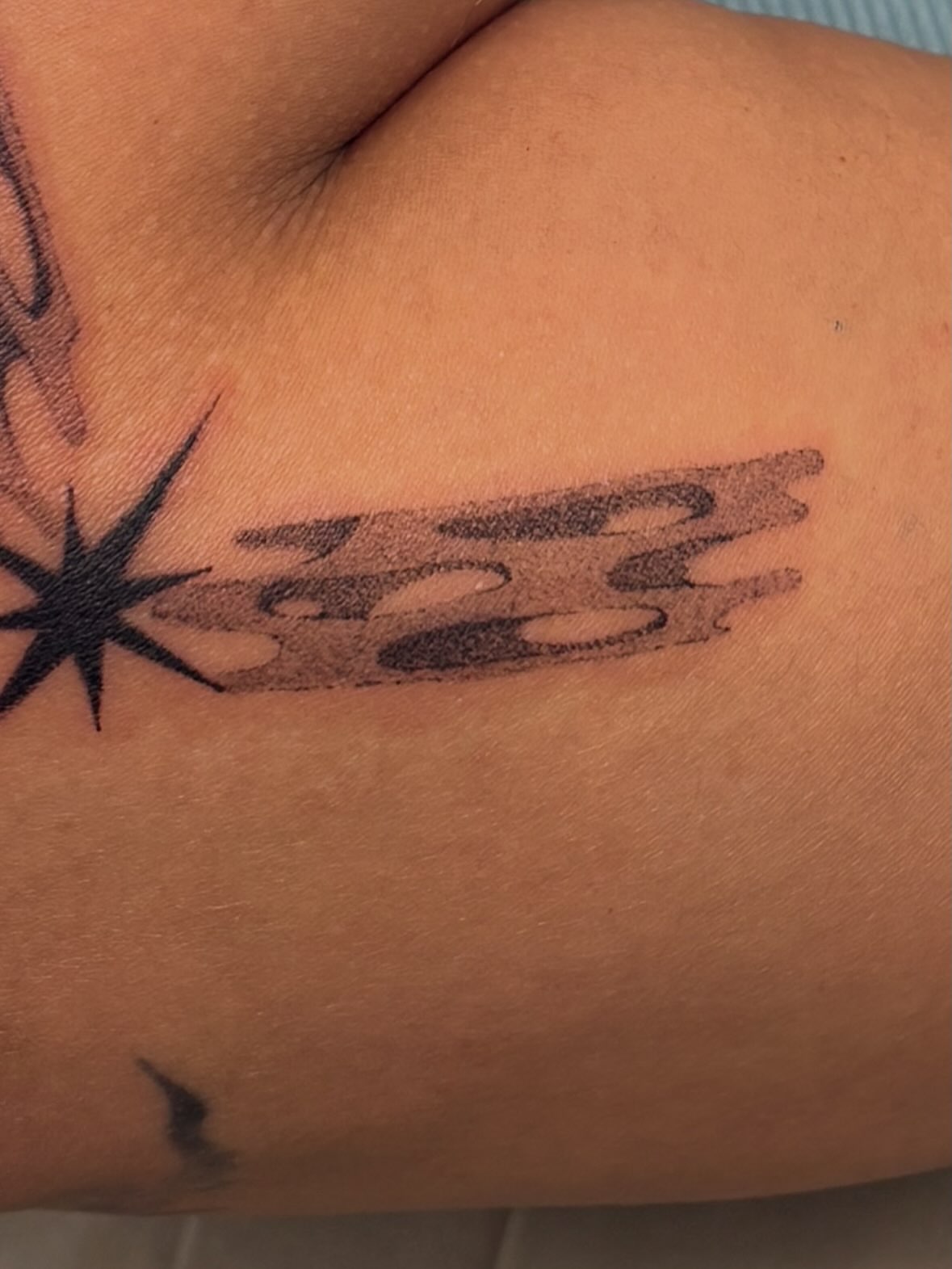 Abstract design black and grey tattoo on the upper arm by ꜱʜɪʀʟᴇʏ