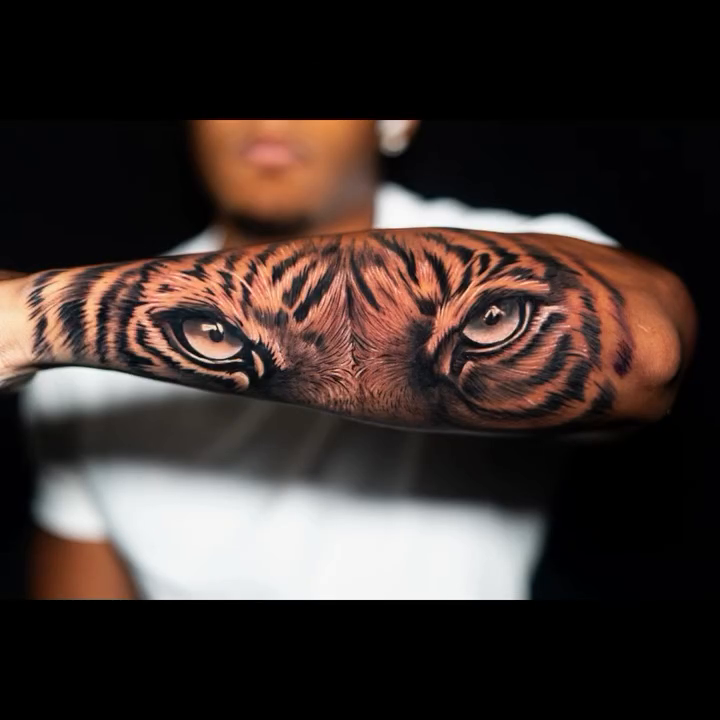 Tiger face realism tattoo on the forearm by James Jurado