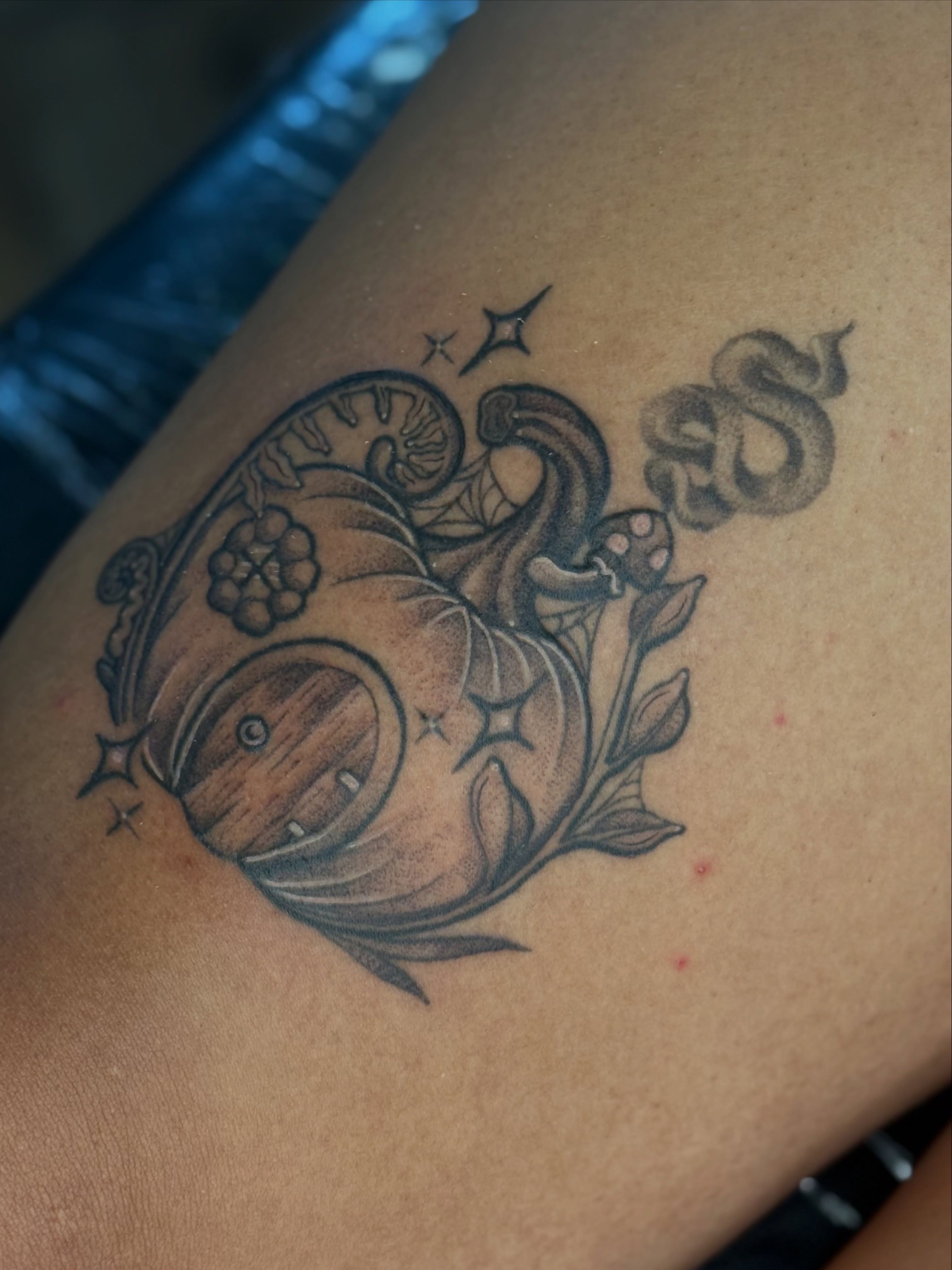 Pumpkin and mushrooms black and grey tattoo on the upper arm by Emma Friesen - Lancaster & York Tattoo Artist, Lancaster, Pennsylvania
