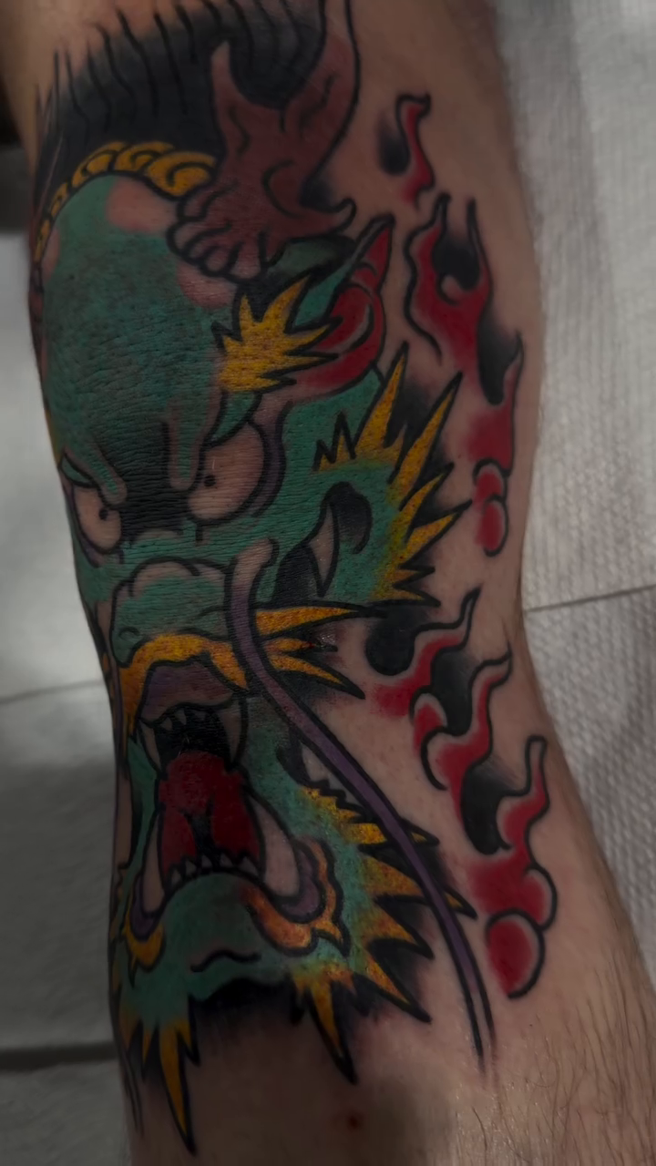 Dragon head Japanese tattoo on the forearm by Don Lee