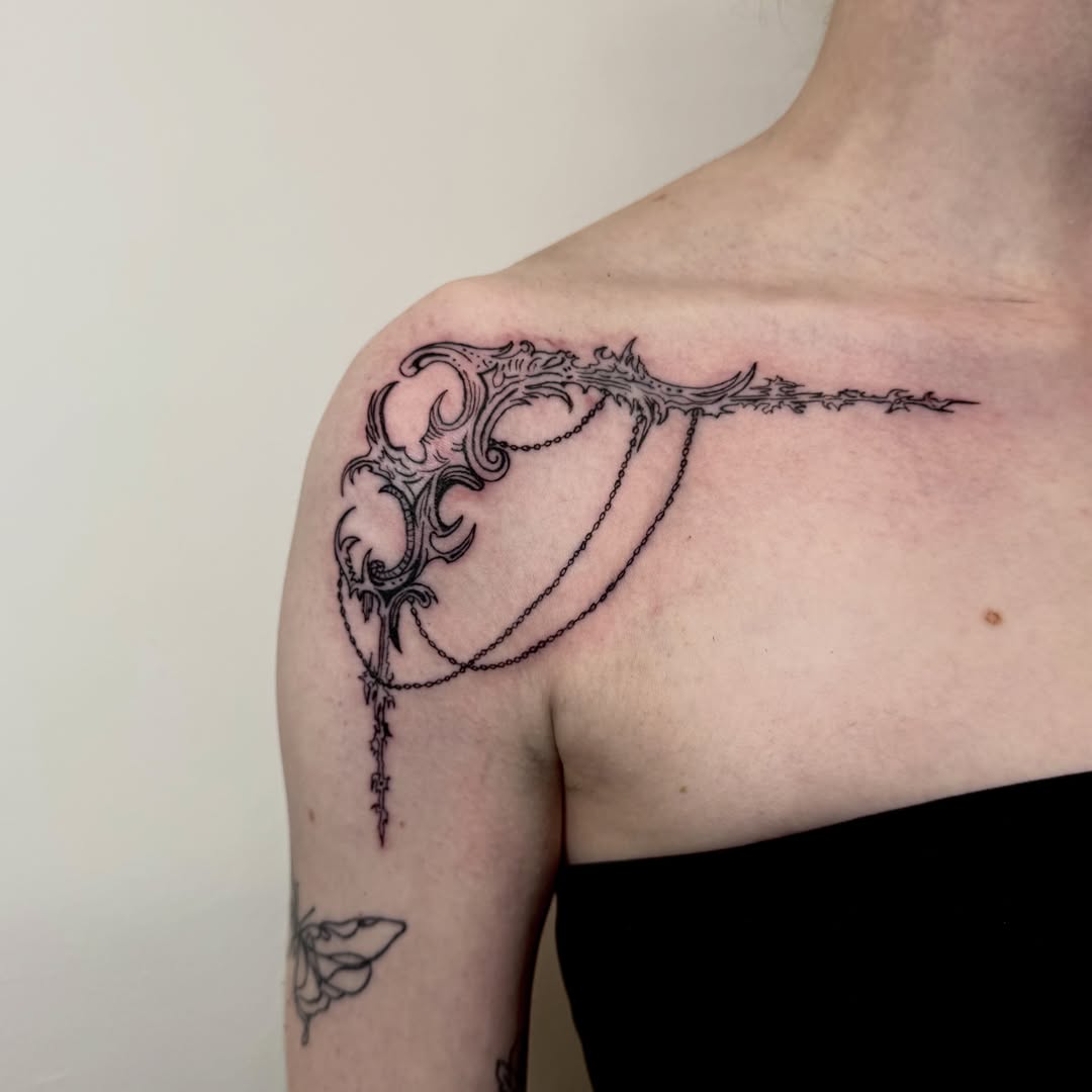 Ornate key ornamental tattoo on the shoulder by dev