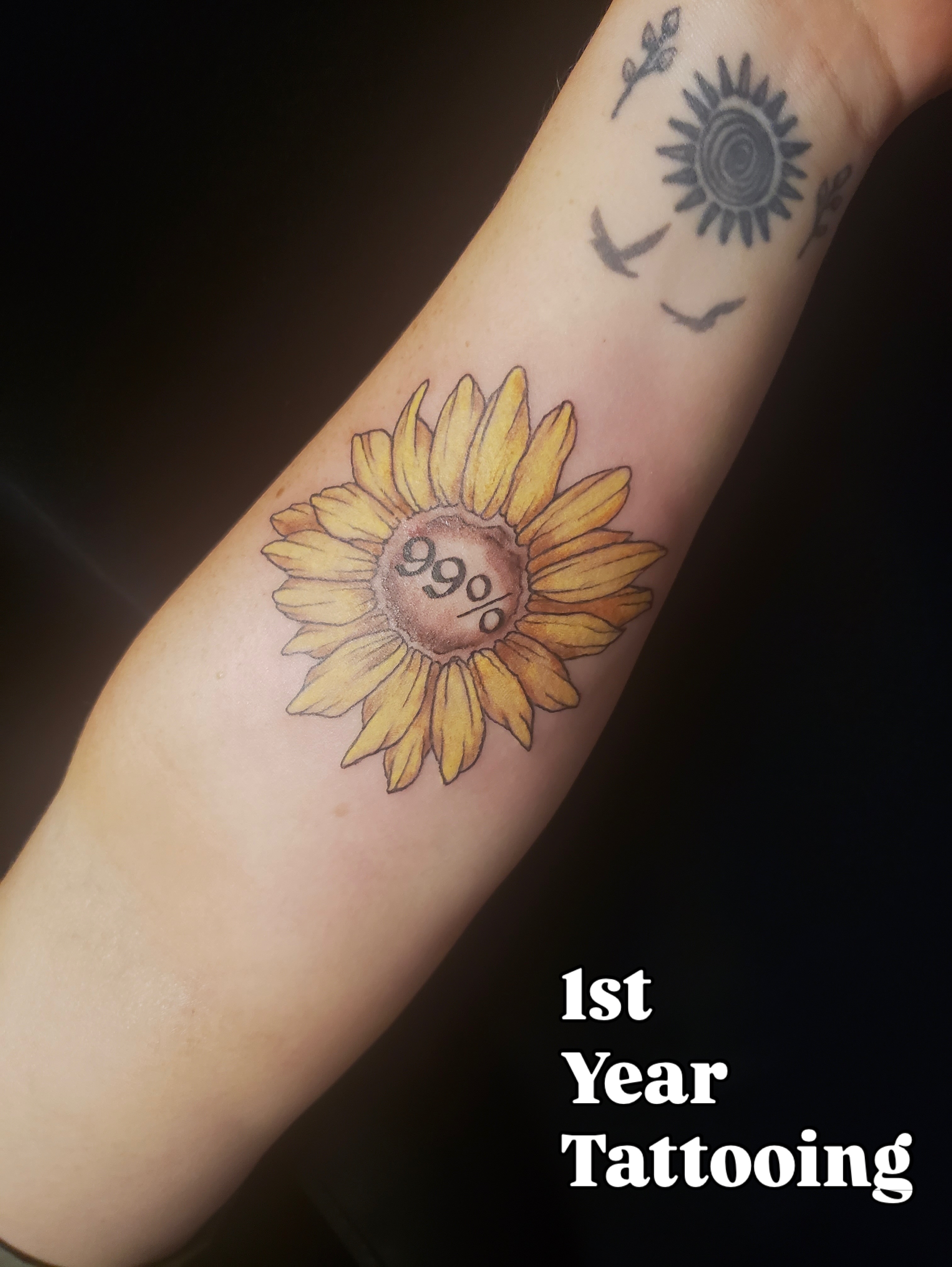 Sunflower realism tattoo on the forearm by Lily Nurnberger