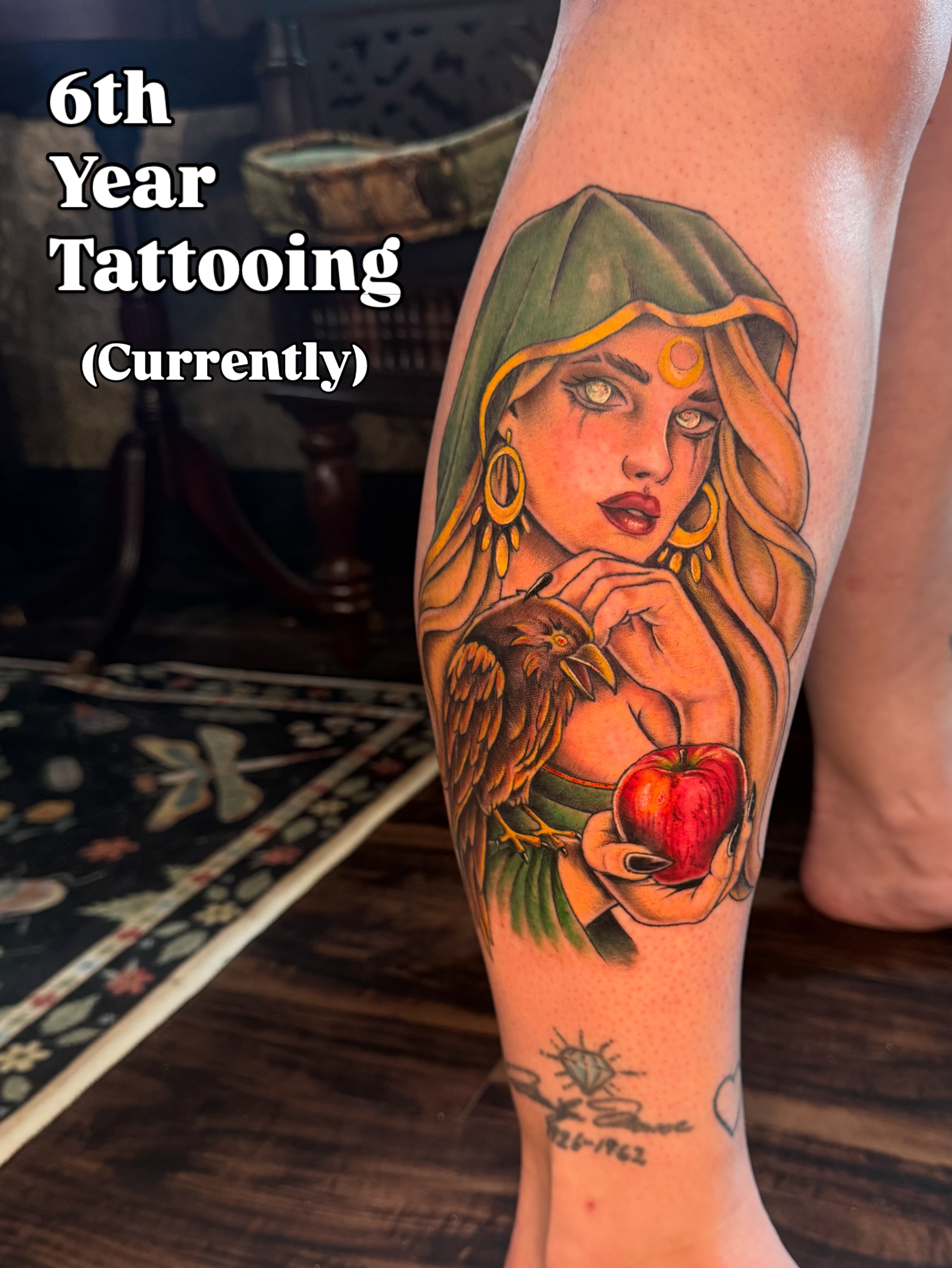 Woman with bird and apple realism tattoo on the forearm by Lily Nurnberger