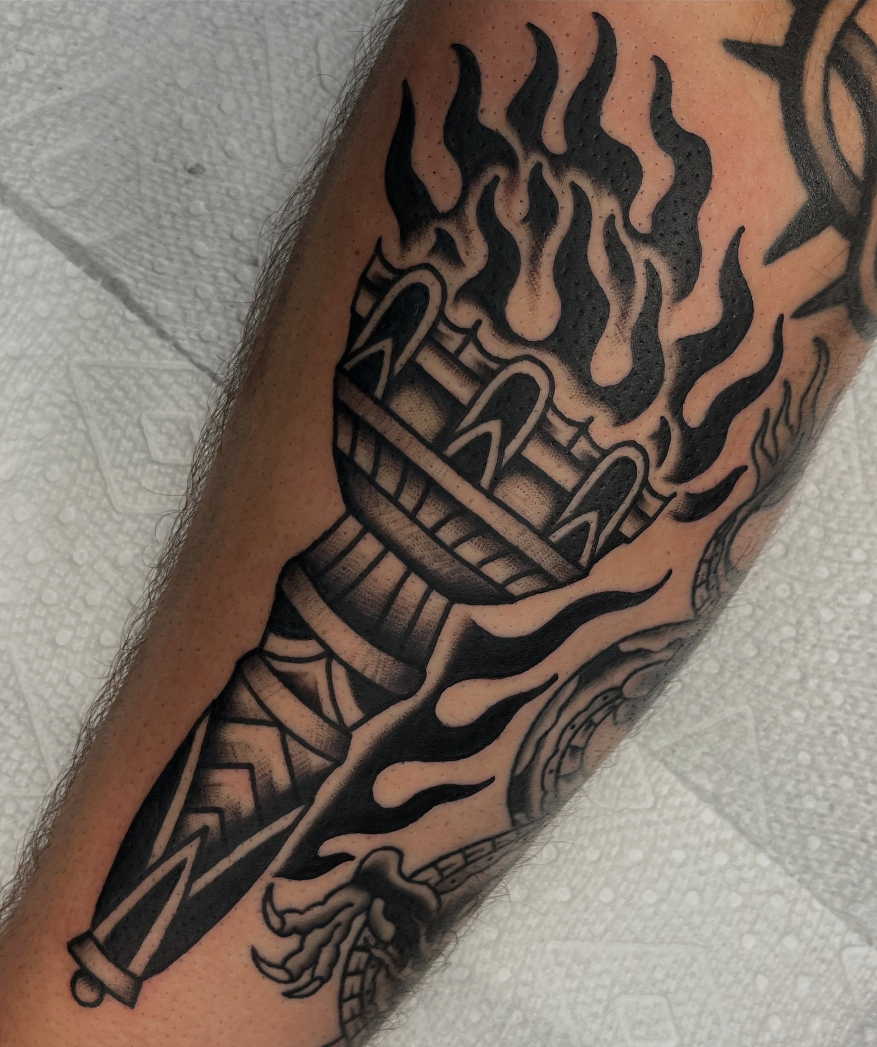 Flame and torch black and grey tattoo on the forearm by August B., Renton, Washington