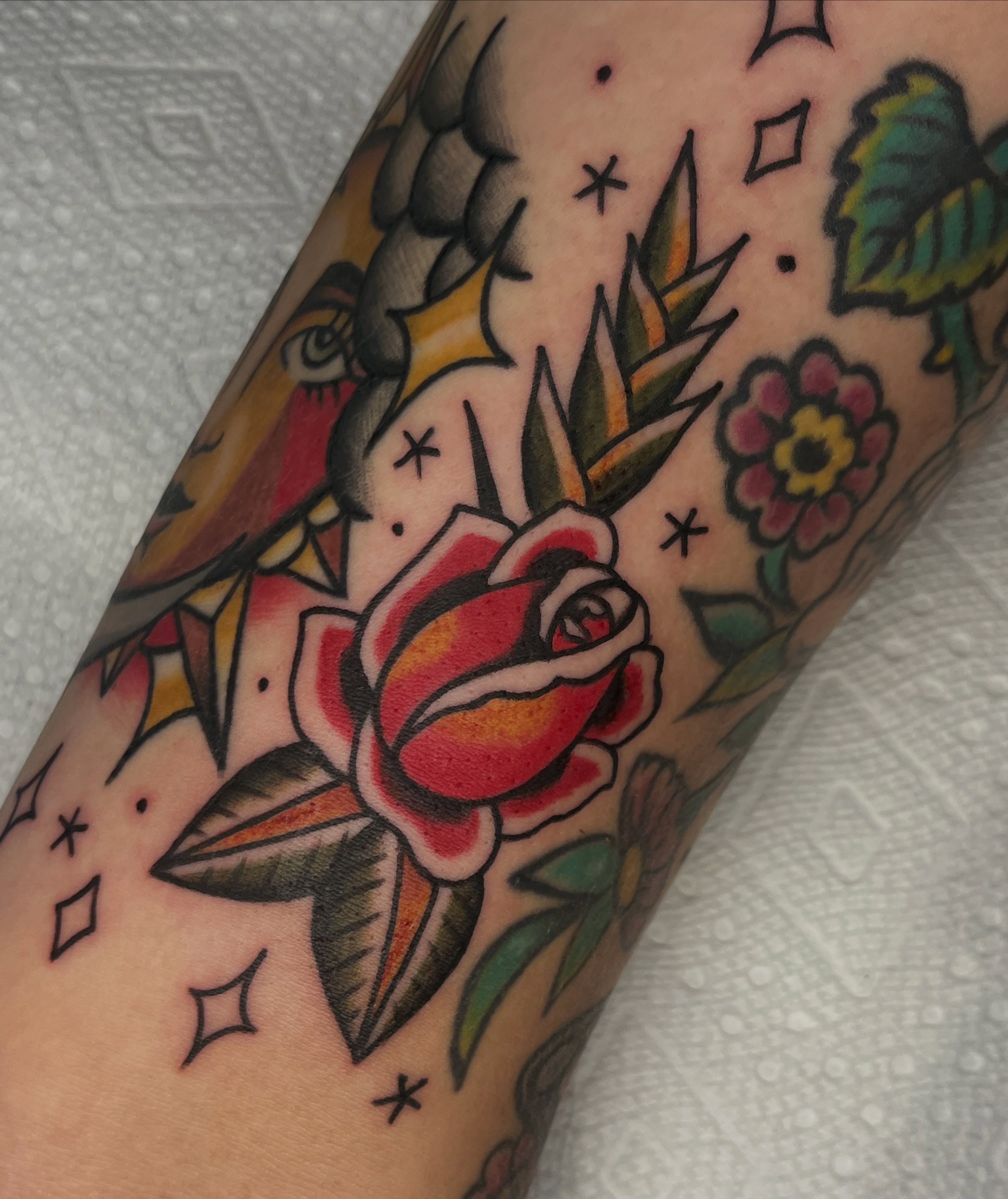 Rose American traditional tattoo on the forearm by August B., Renton, Washington