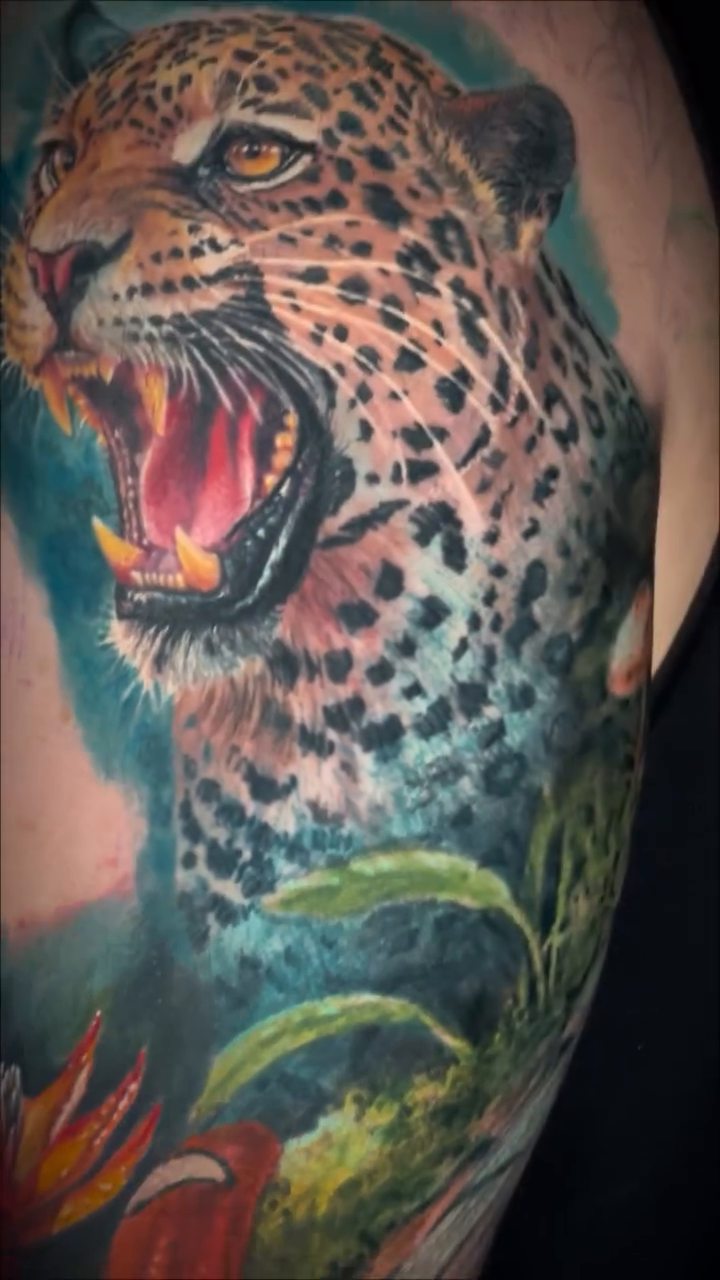 Leopard and snake in jungle realism tattoo by Brian Ulibarri