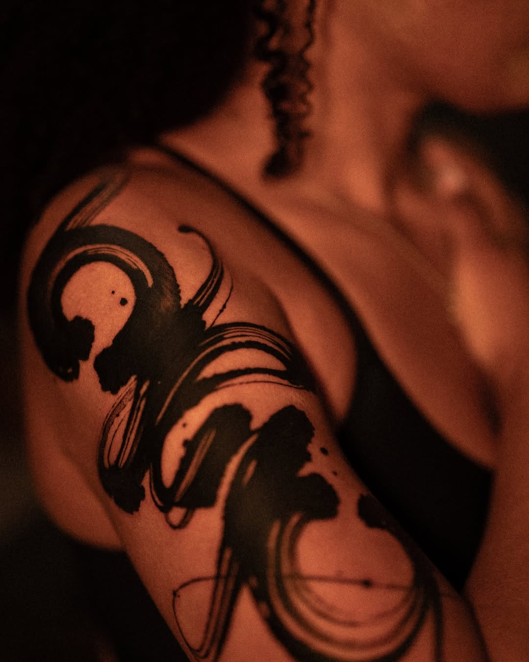 Abstract brush strokes tribal tattoo on the shoulder by Low, Brooklyn, New York