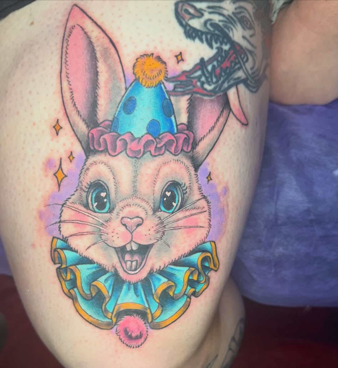 Clown rabbit illustrative tattoo on the thigh by Shelby Warren