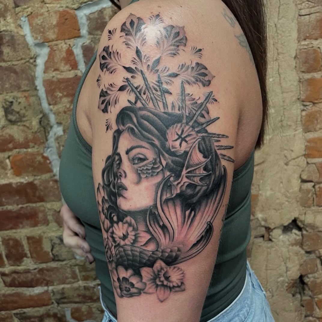 Mermaid with floral elements realism tattoo on the shoulder by Auzzy the Ink Pirate, Mansfield, Ohio