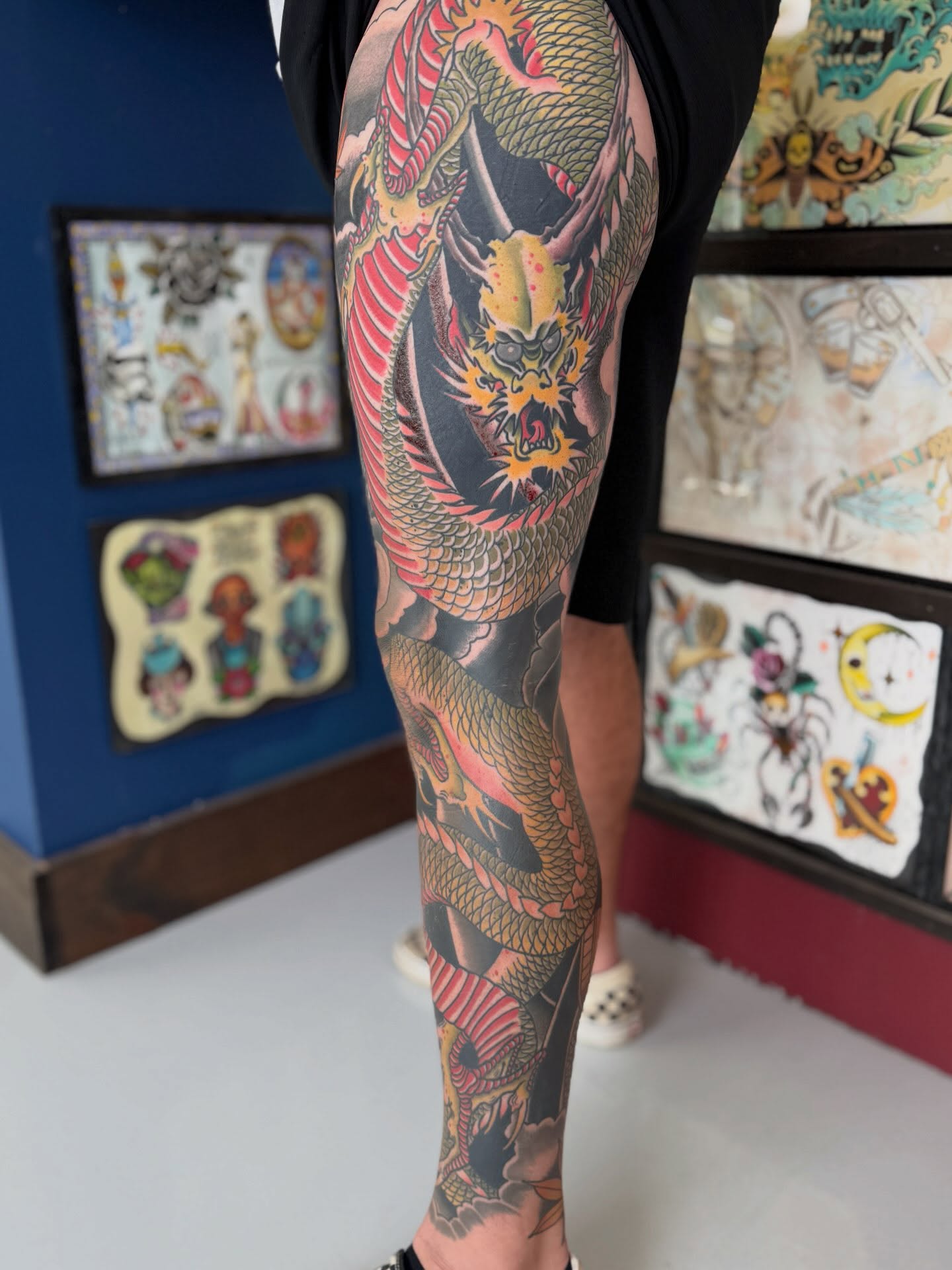 Dragon American traditional tattoo on the leg by Trent Parsley