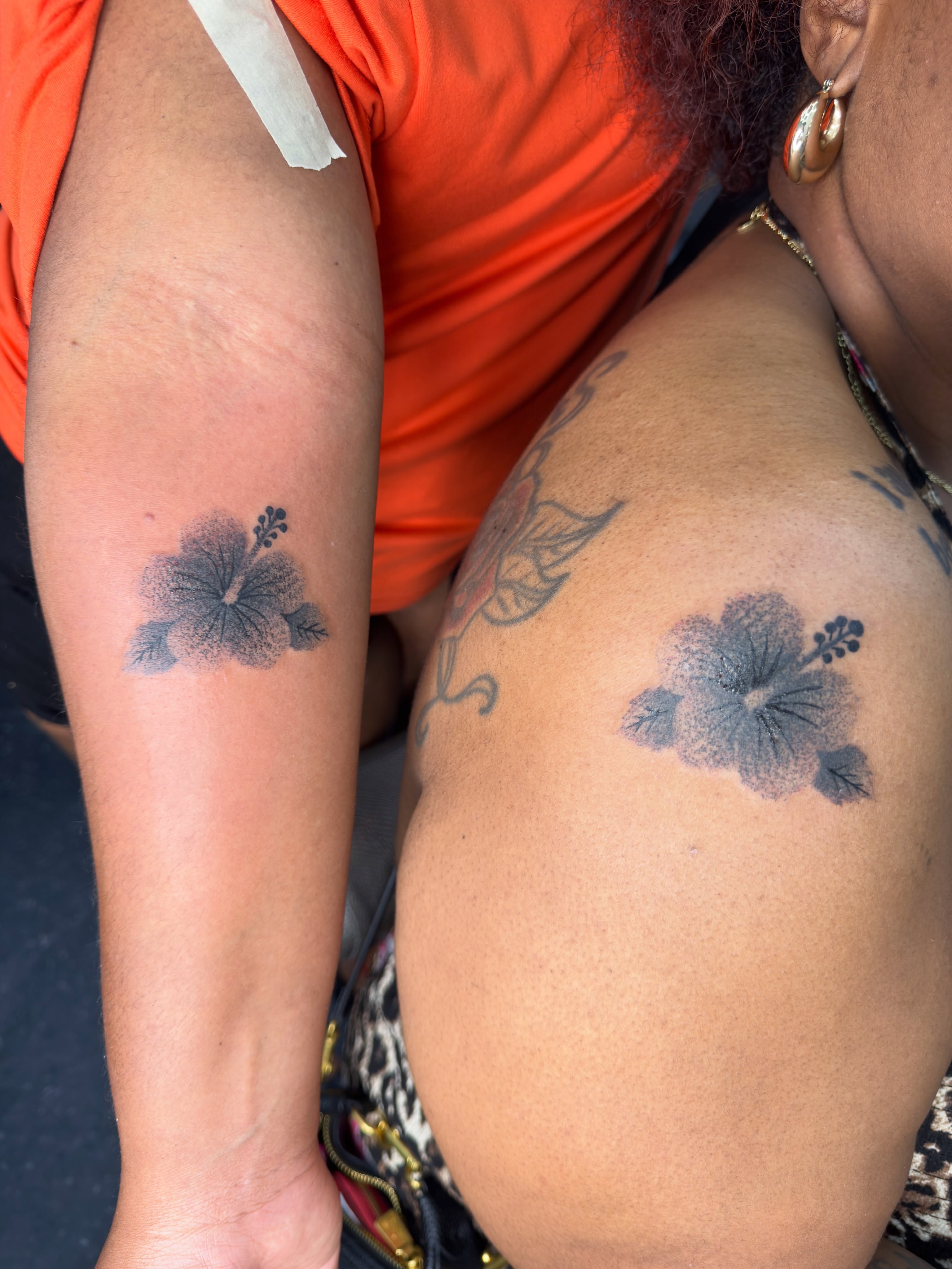 Hibiscus flower black and grey tattoo on the shoulder by Joshua Carter