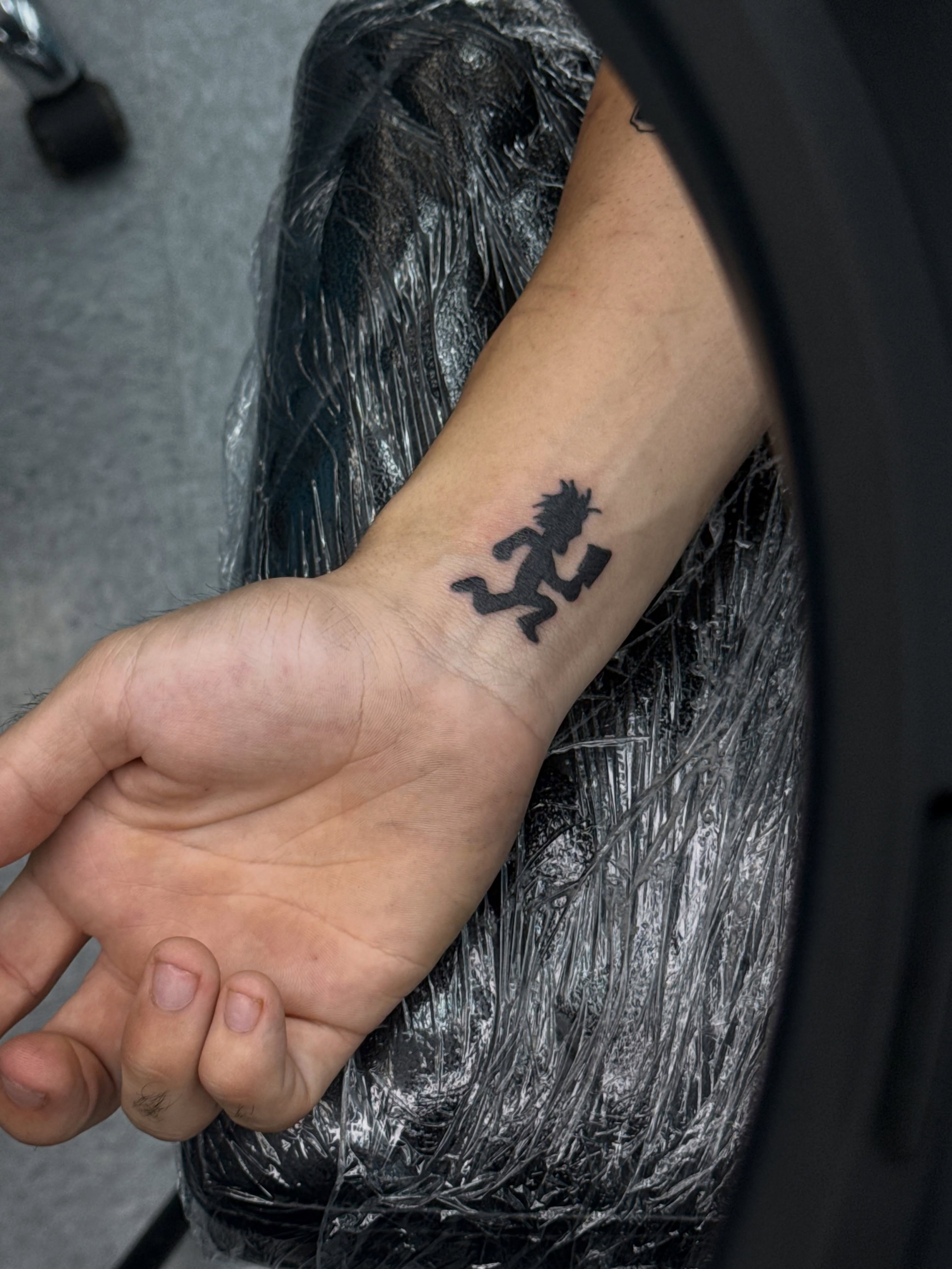 Demon black and grey tattoo on the forearm by ⠀Greave