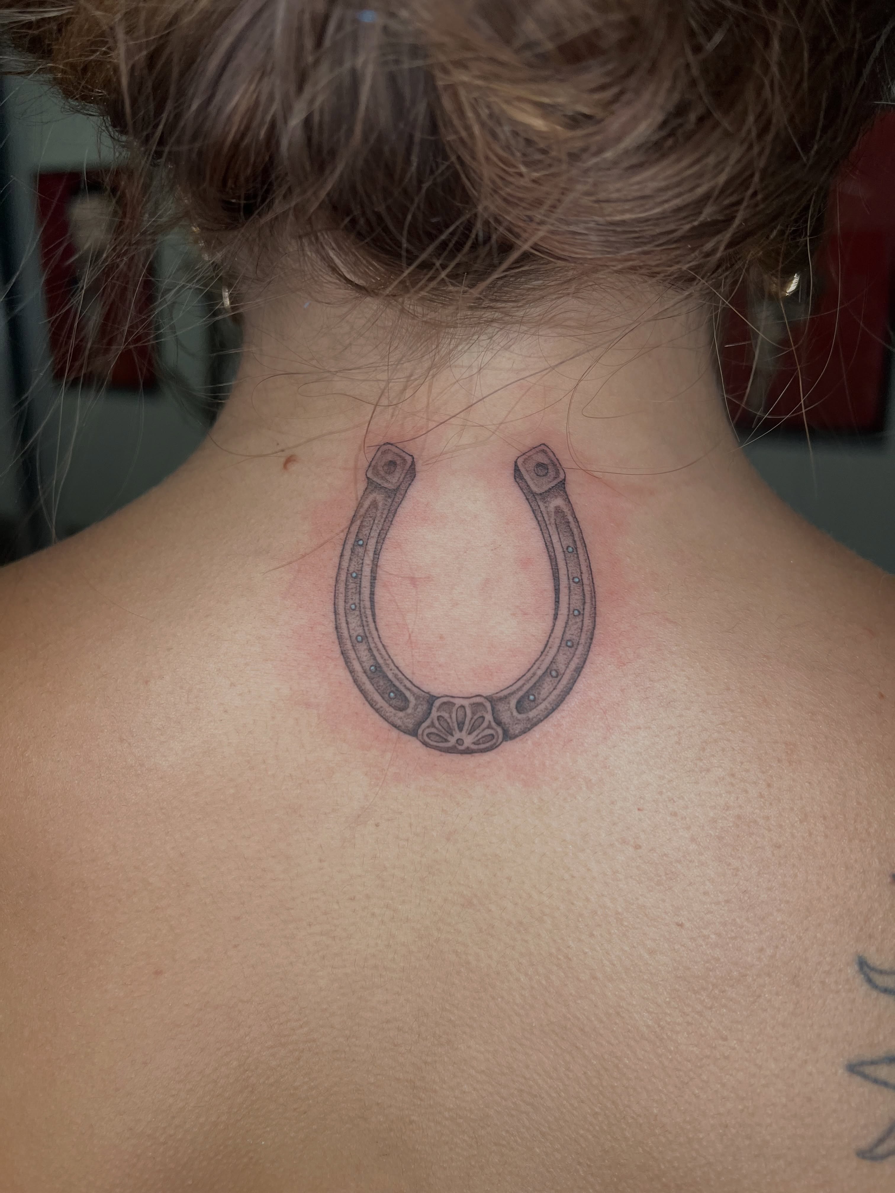 Horseshoe black and grey tattoo on the back by ๐ฆ๐๐๐ก ๐ฆ๐๐๐