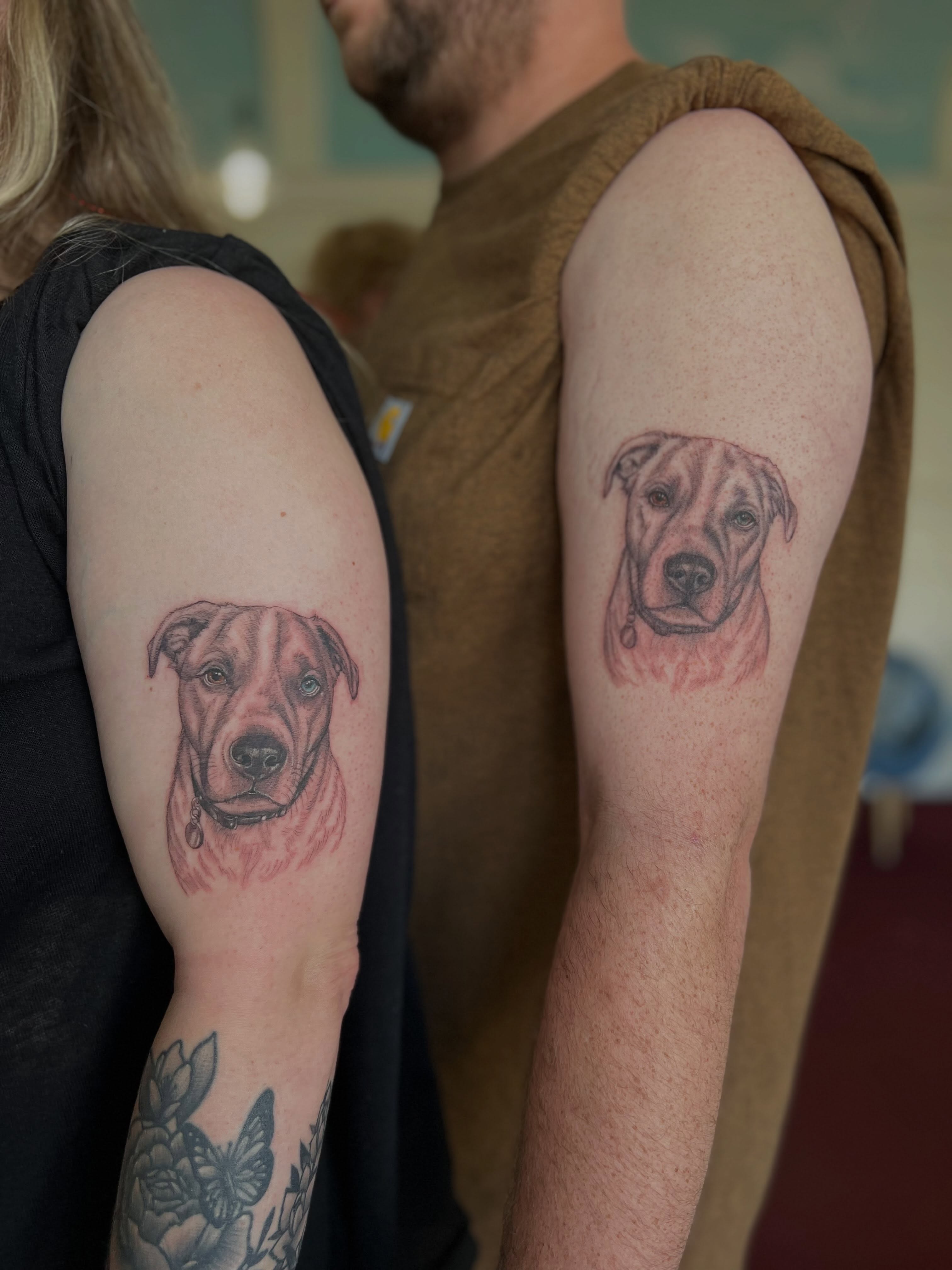 Dog portrait realism tattoo on the upper arm by Jordi WA Tacoma Tattooer