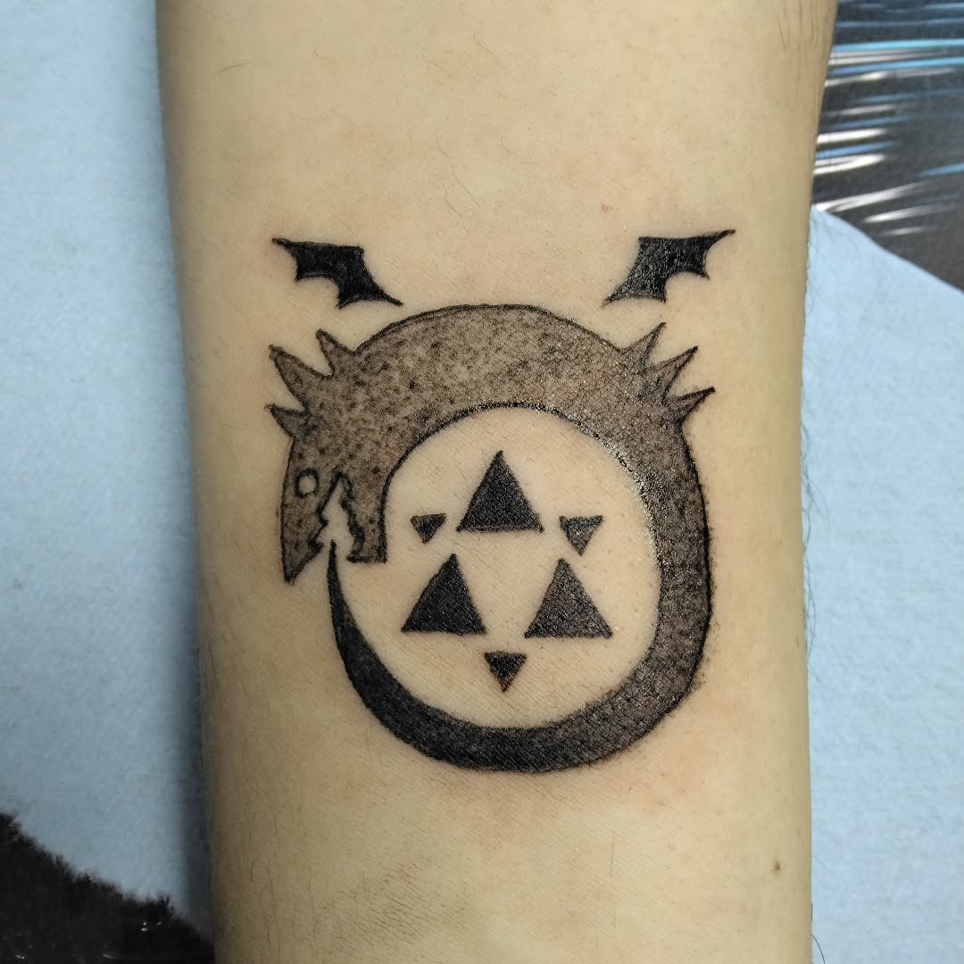 Ouroboros symbol with triangles cyber sigilism tattoo on the forearm by Malynda
