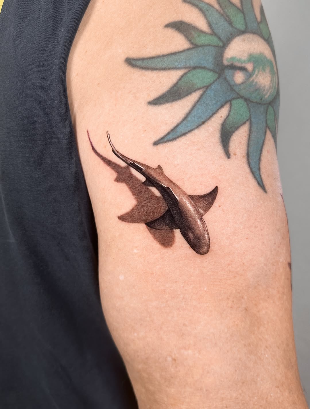 Shark fine line tattoo on the upper arm by Saru