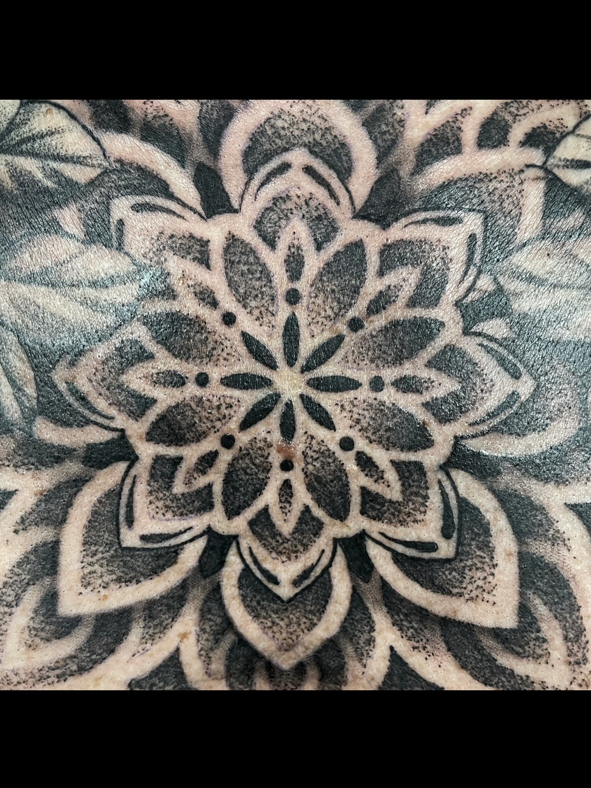 Geometric mandala dotwork tattoo by Robbie Bryant