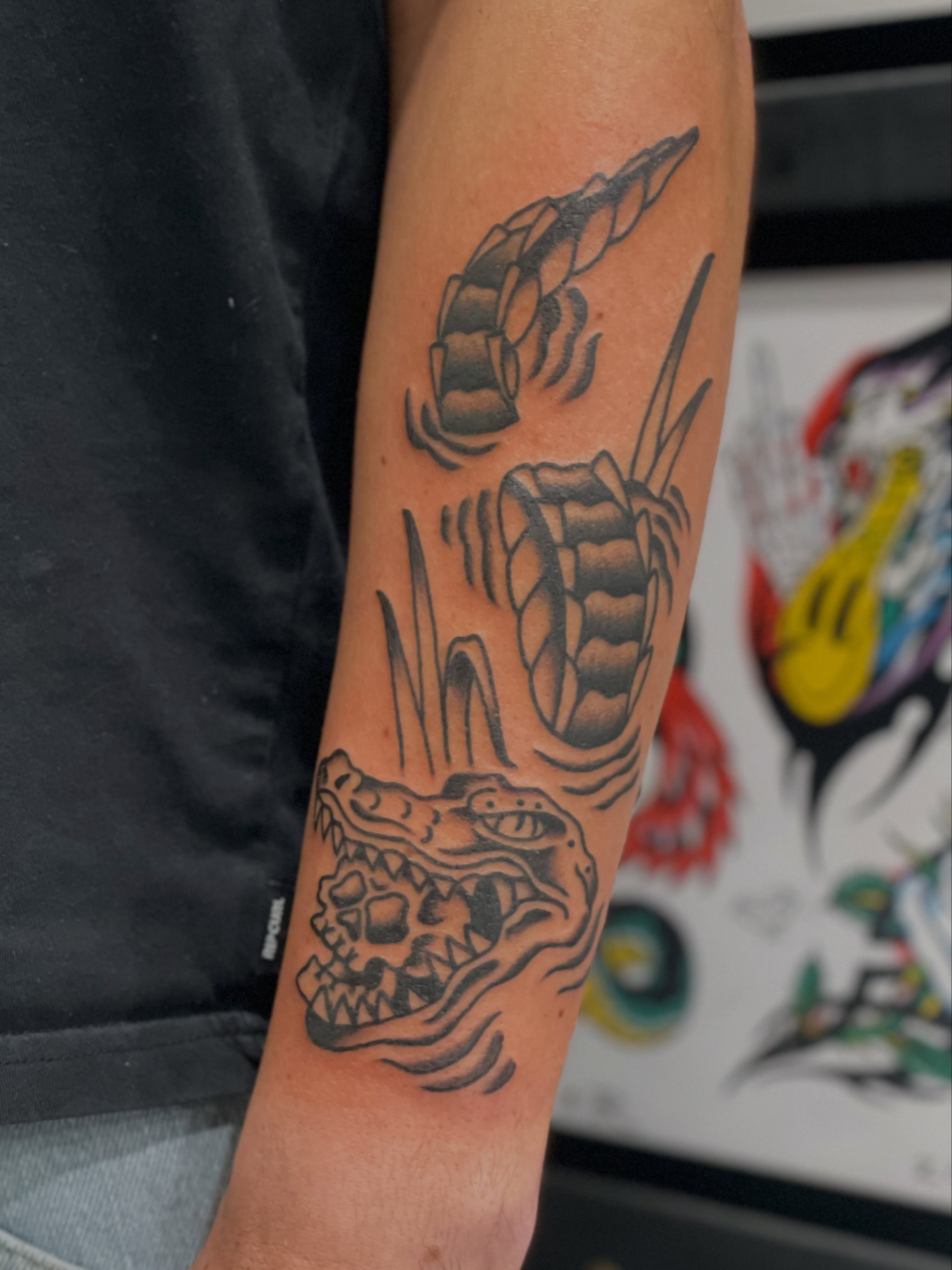 Crocodile American traditional tattoo on the forearm by Greg De Hoot, Youngsville, North Carolina