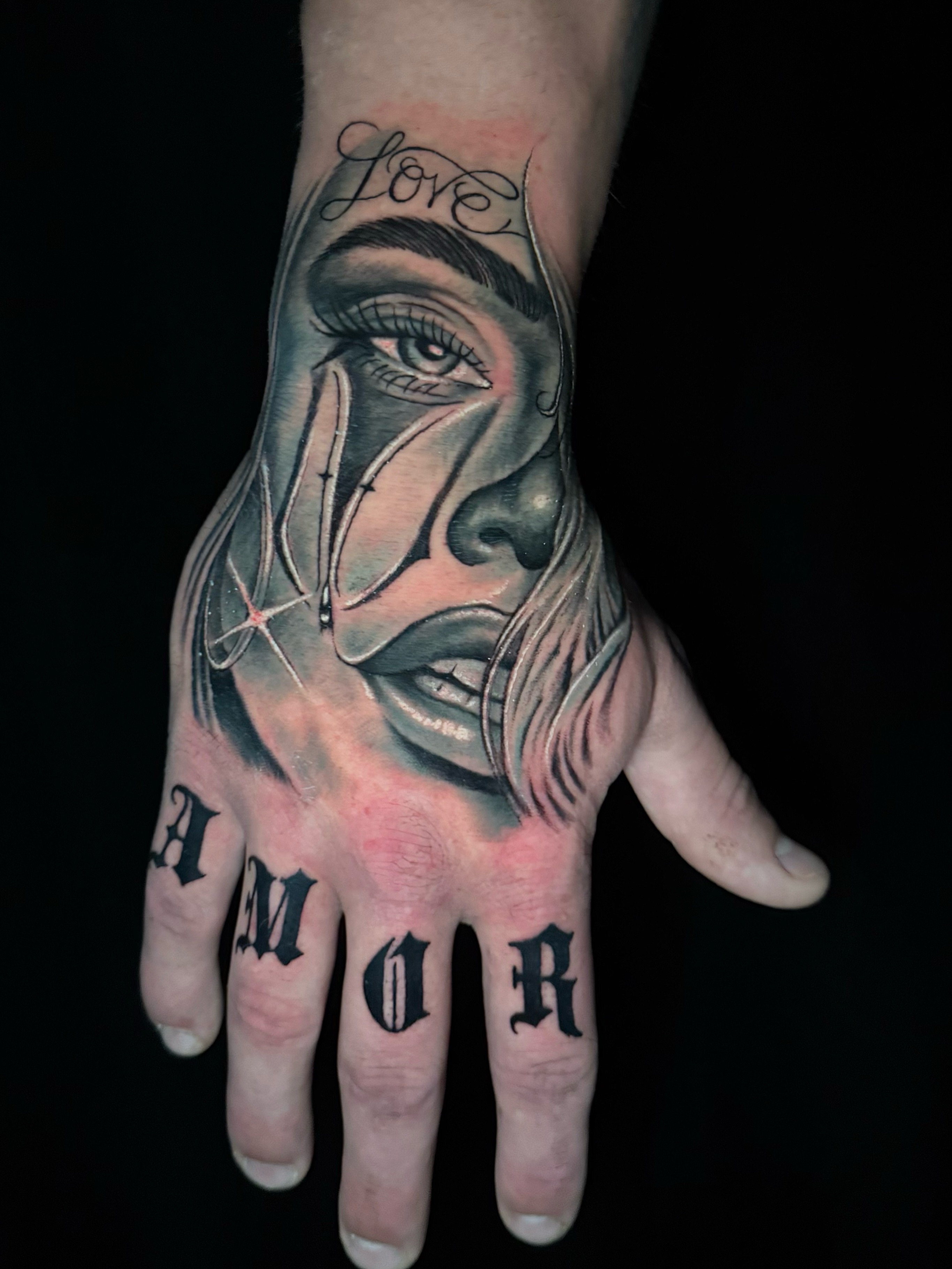 Face realism tattoo on the hand by @luckybunnytat2