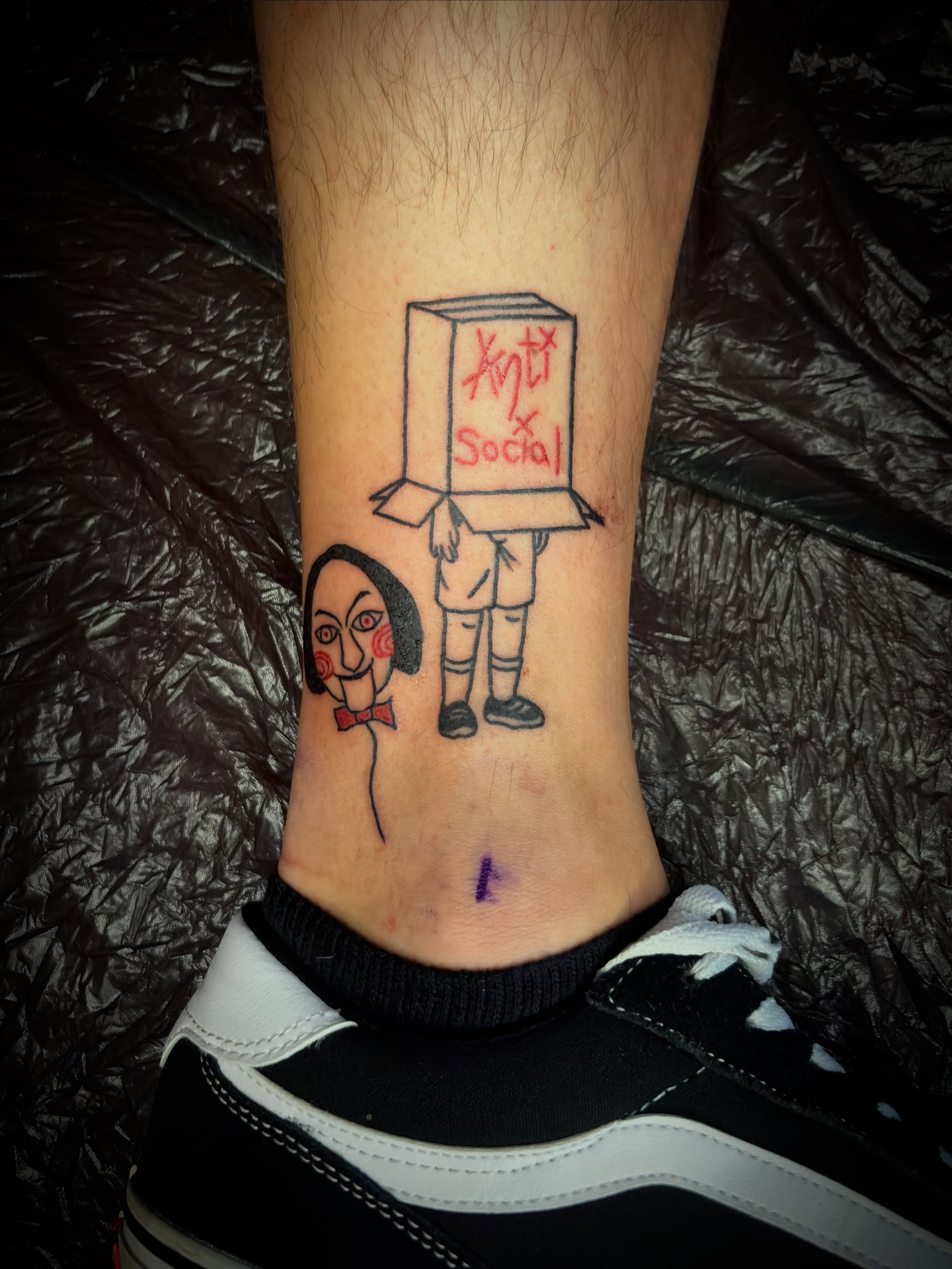 Anti-social box head illustrative tattoo on the calf by lu ๐