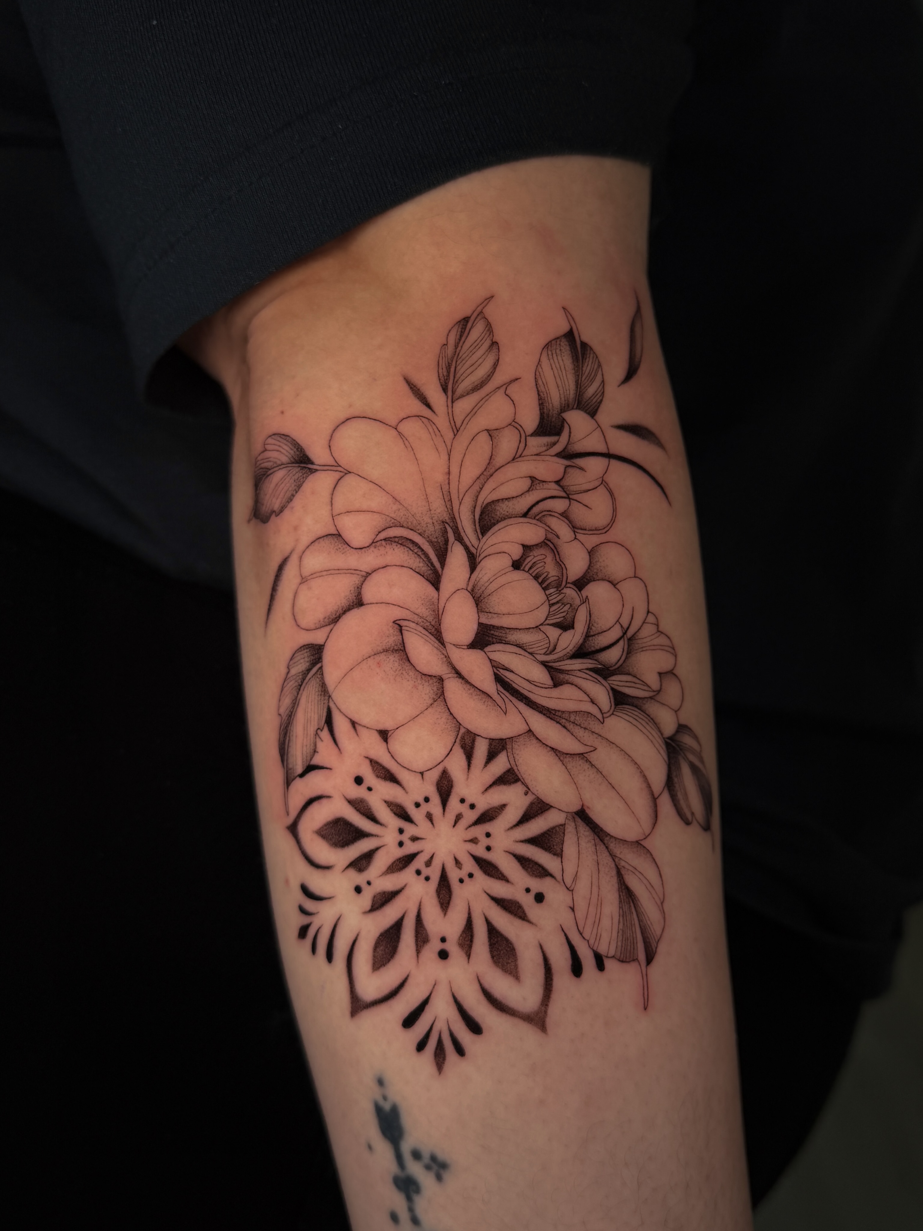 Floral mandala geometric tattoo on the forearm by Marianne
