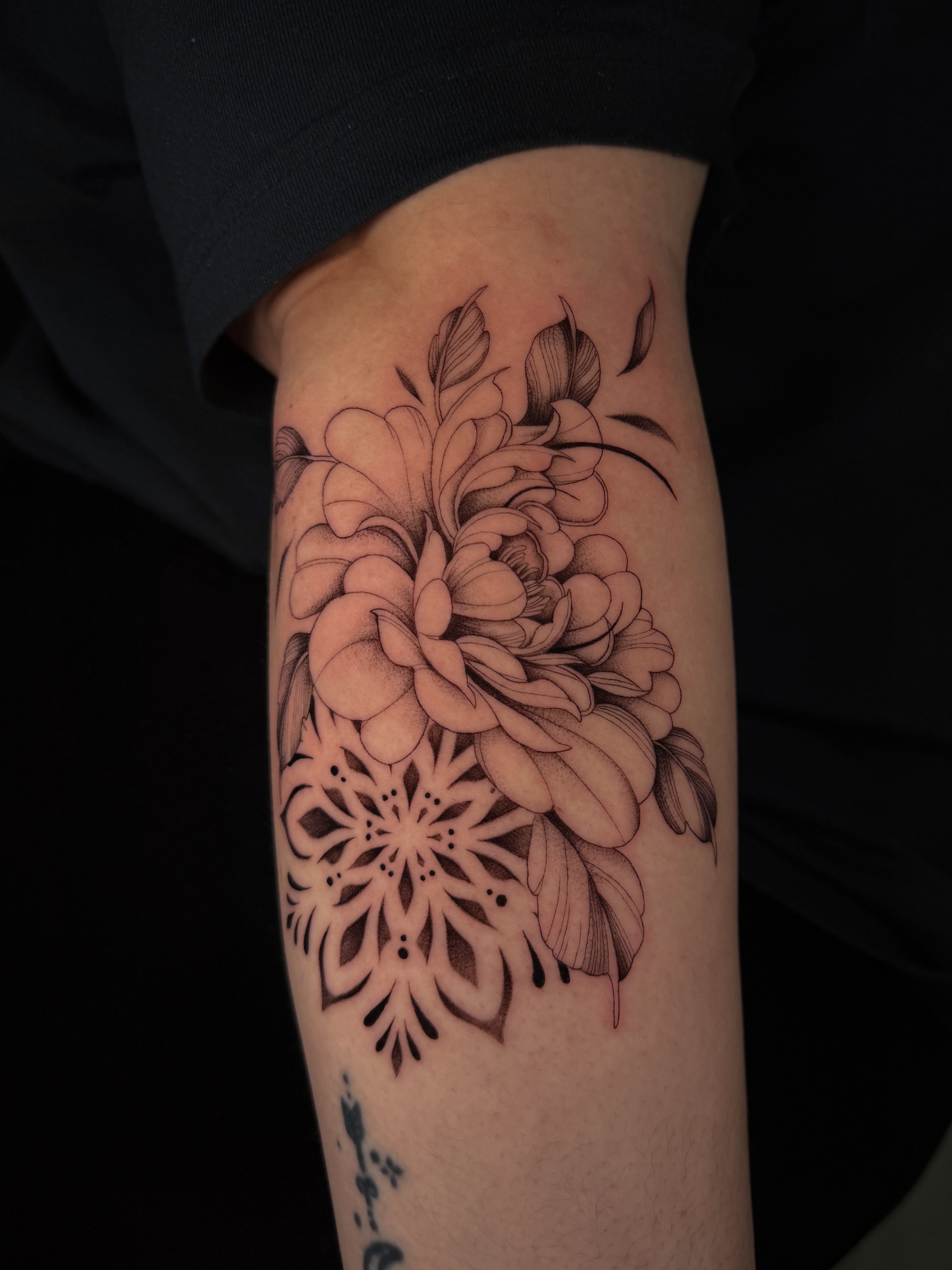 Floral mandala geometric tattoo on the forearm by Marianne